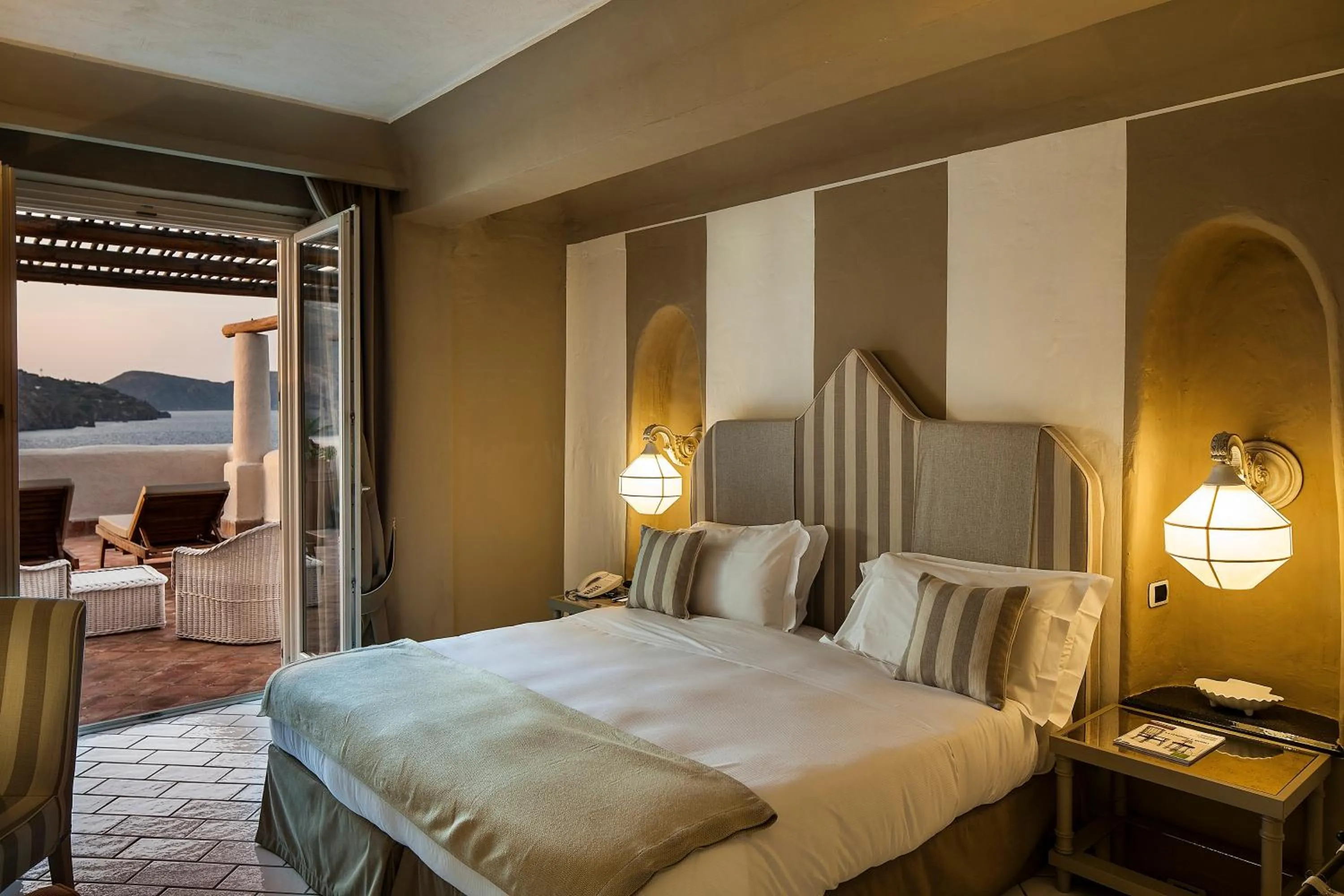 Balcony/Terrace, Bed in Therasia Resort Sea and SPA - The Leading Hotels of the World