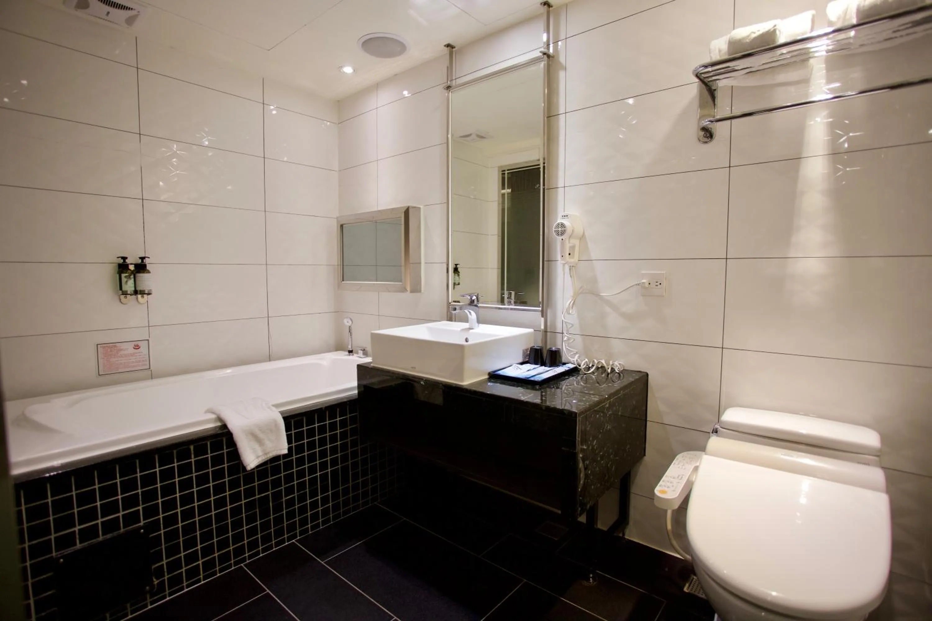 Bathroom in V-one Vogue Hotel