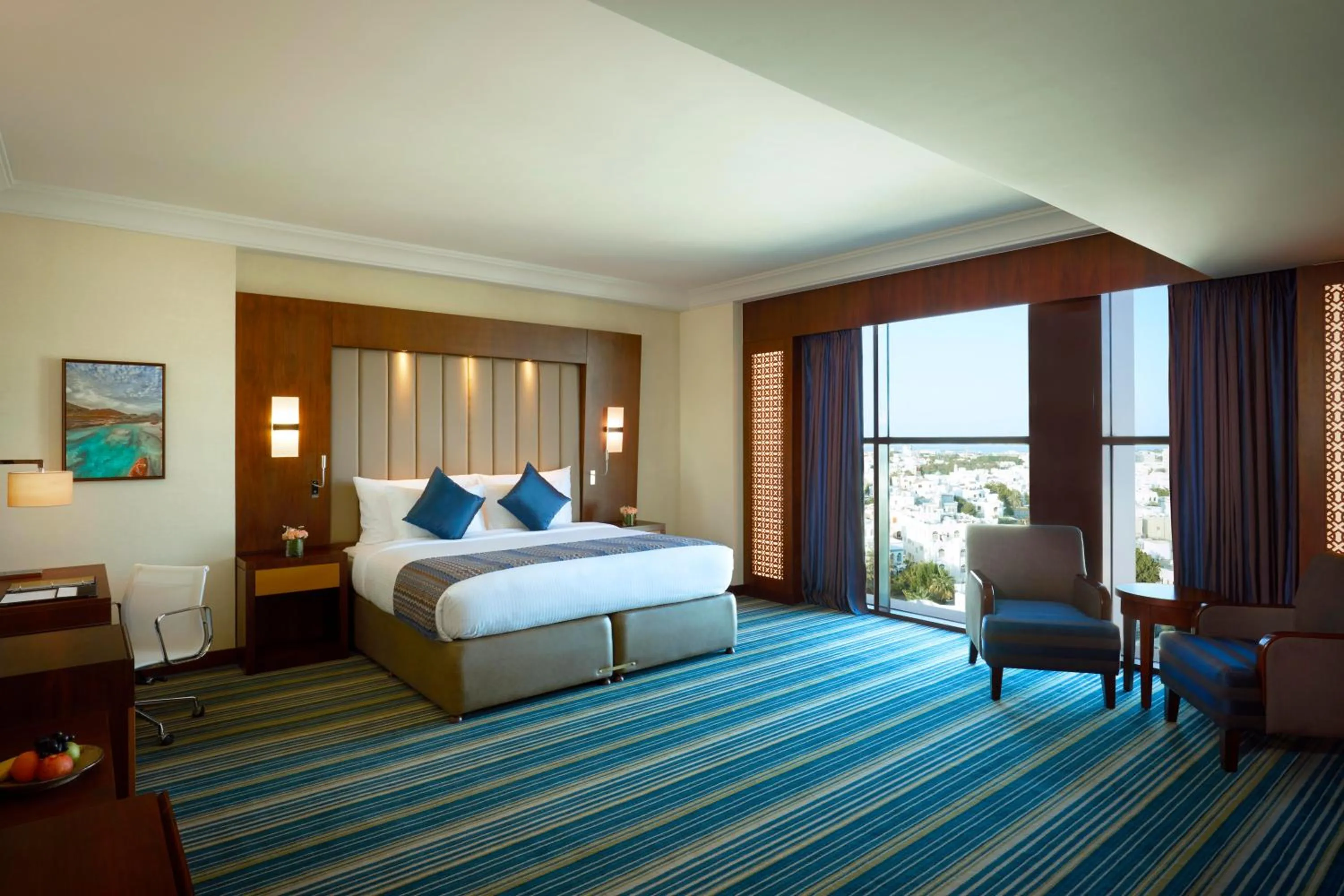 Photo of the whole room, Bed in Royal Tulip Muscat