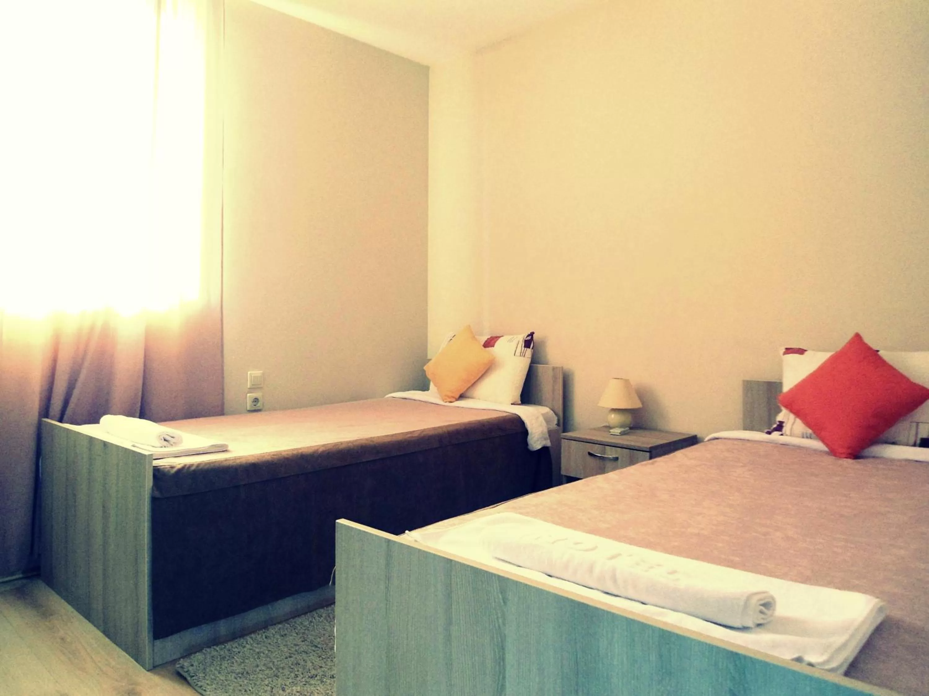 Bed in Garni Hotel Tri O