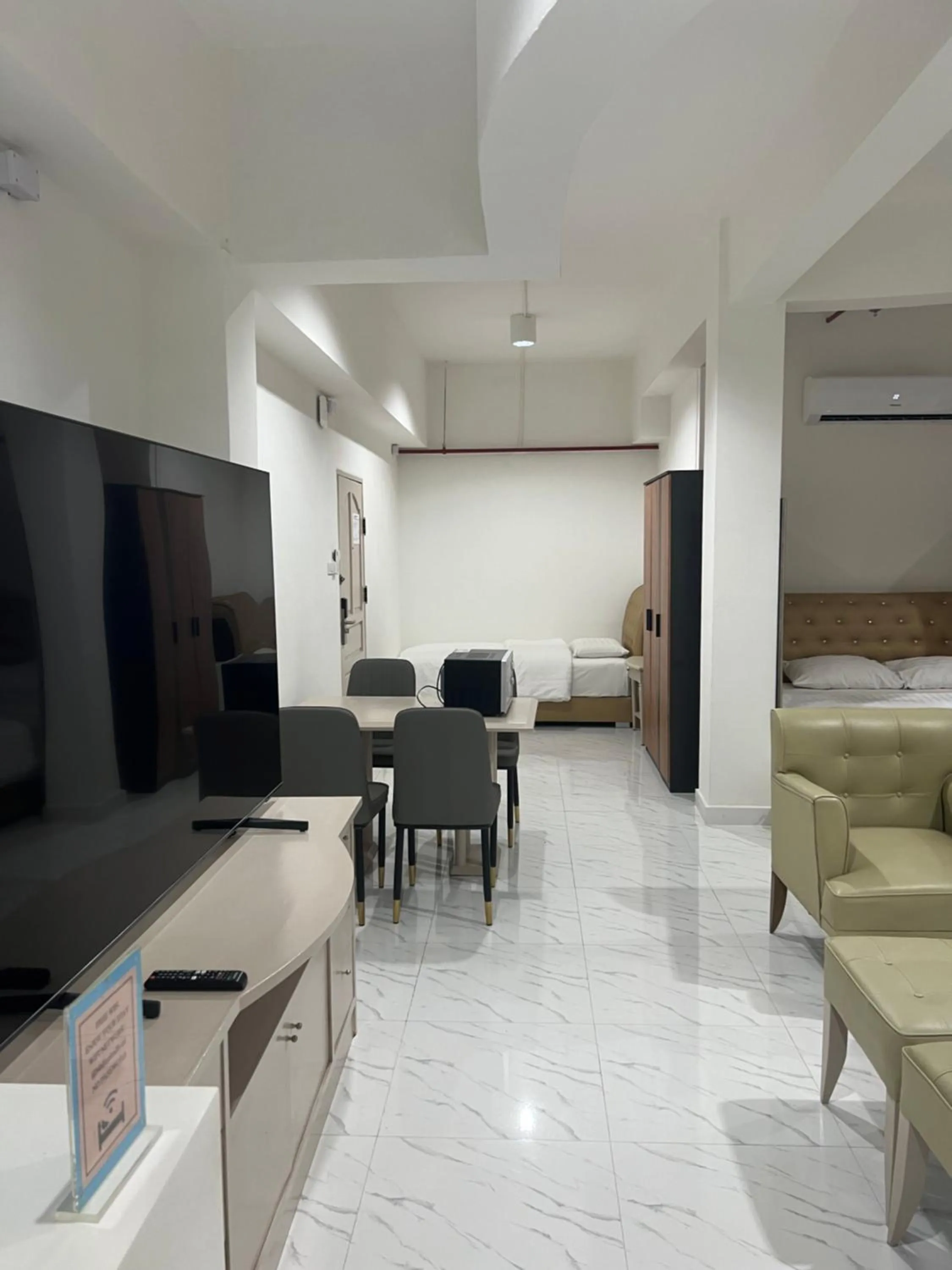 Bed in Mall Suites Hotel