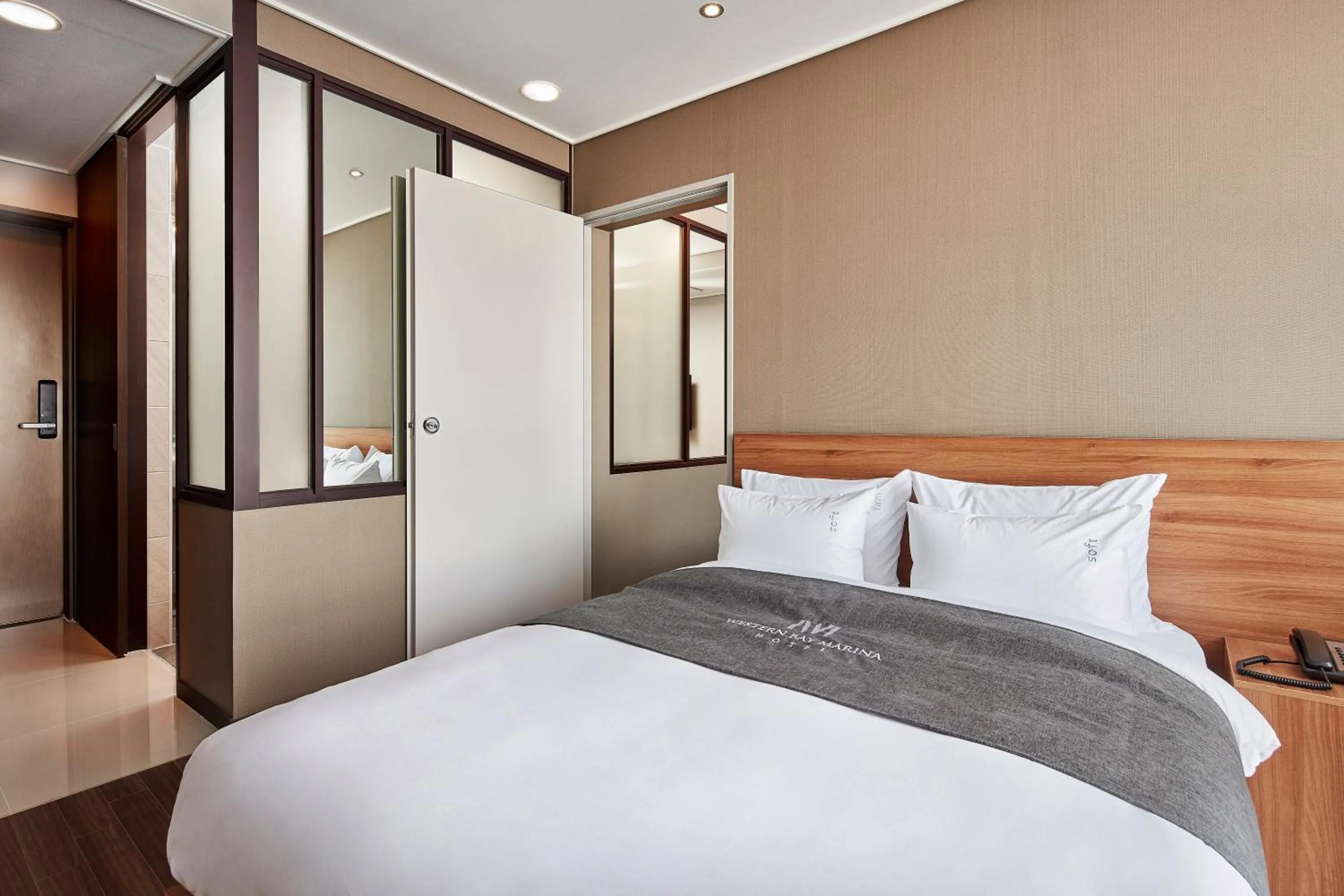 Bed in Western Bay Marina Hotel