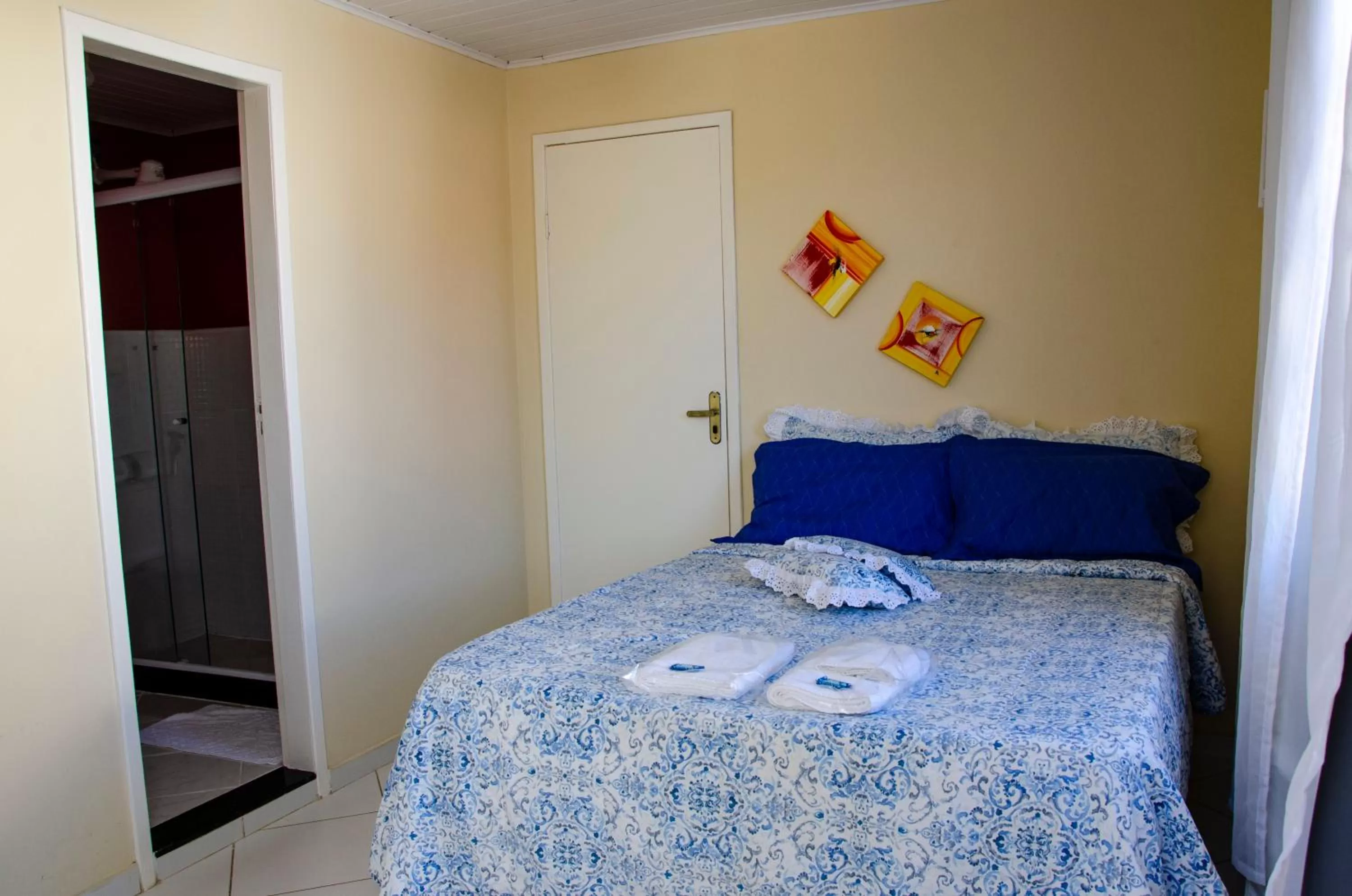 Bed in Pousada Luzes de Geribá