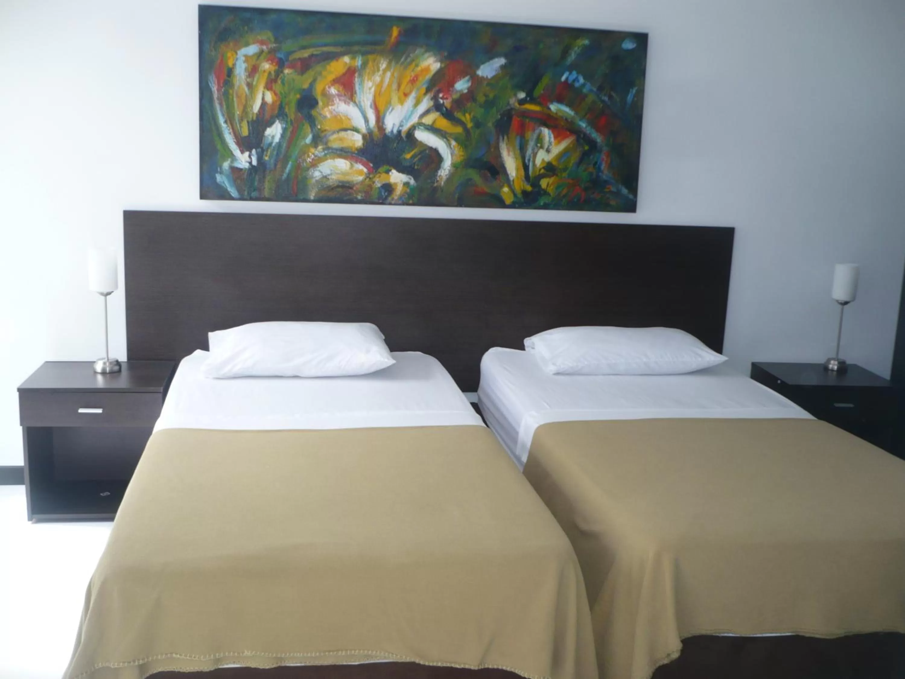 Bed in Apartasuites San Marcos