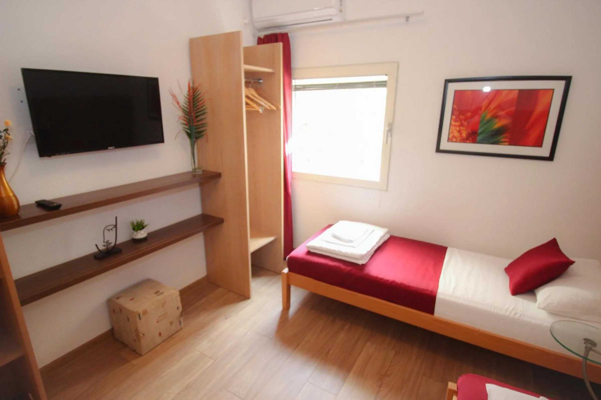 Bed, Seating Area in Motel Deny