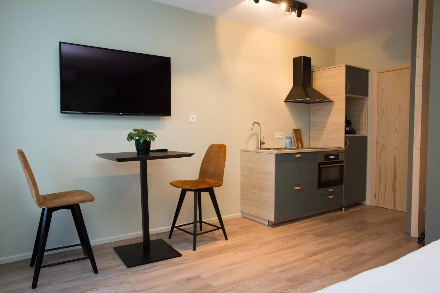 Kitchen or kitchenette in Appart hôtel En Ville