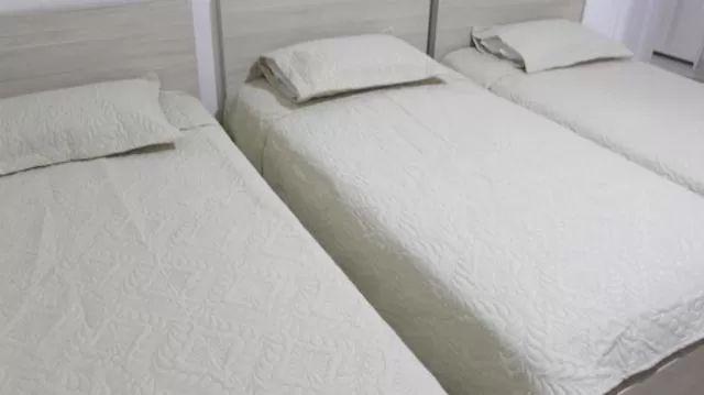 Bed in Hotel Iraka Zenu