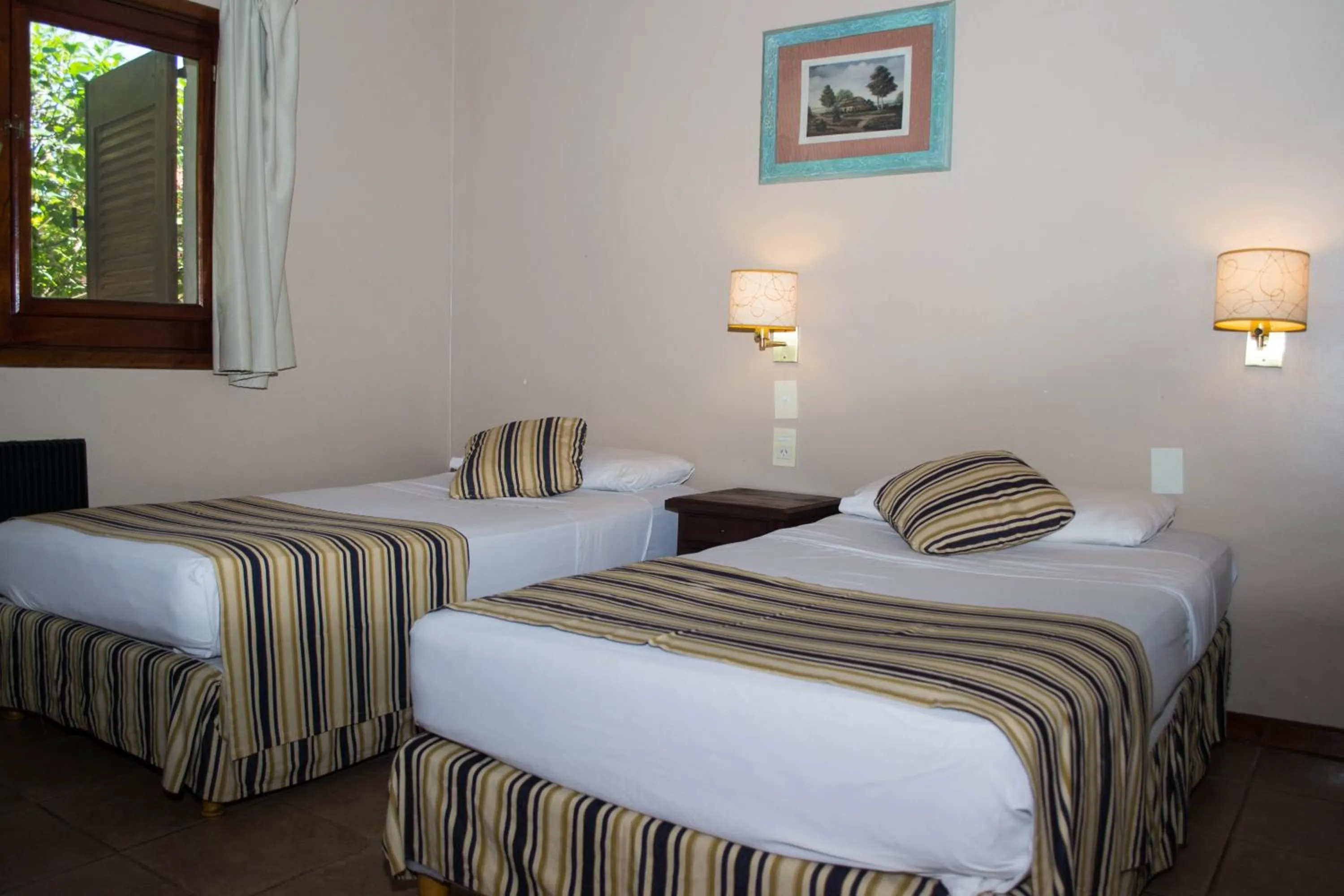 Bed in Marcopolo Suites Iguazu