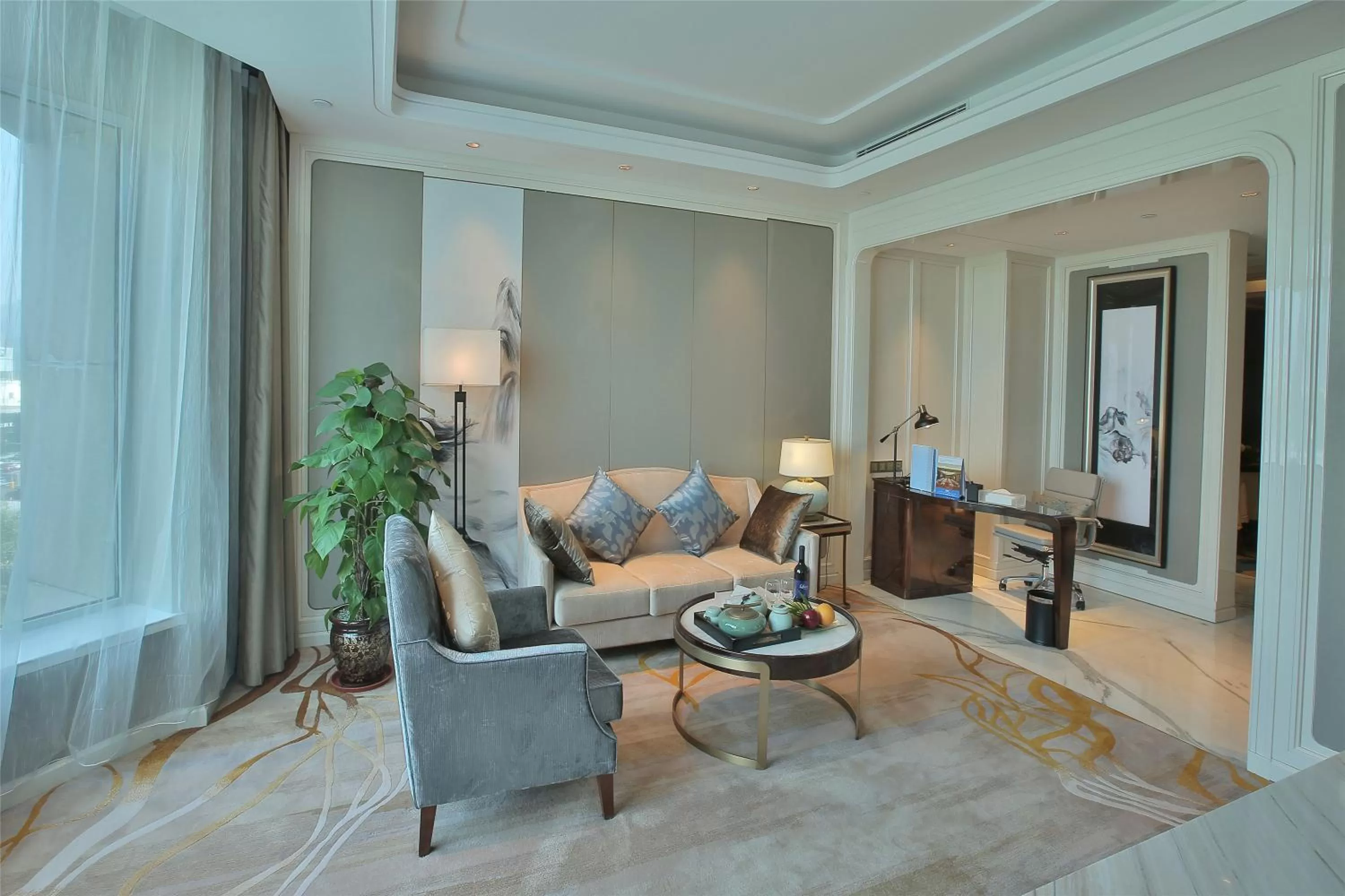 Living room in Wyndham Qingdao l Free Fixed-Time Shuttle Service Between Hotel and Airport & North Railway Station l Outdoor Children's Amusement Park l 1-Hour Play Snooker or Table Tennis