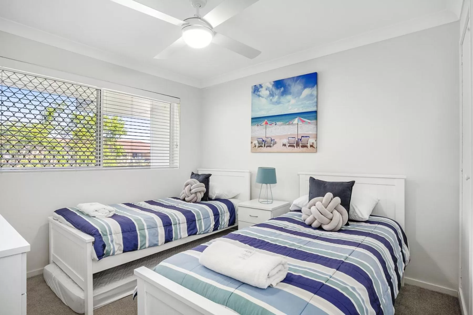 Bed in Kirra Palms Holiday Apartments