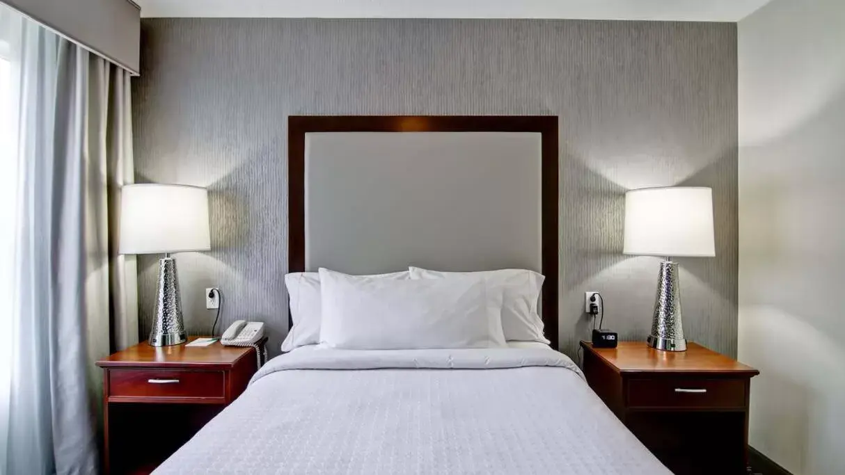 Bed in Poplar Inn and Suites Bed in Poplar Inn and Suites