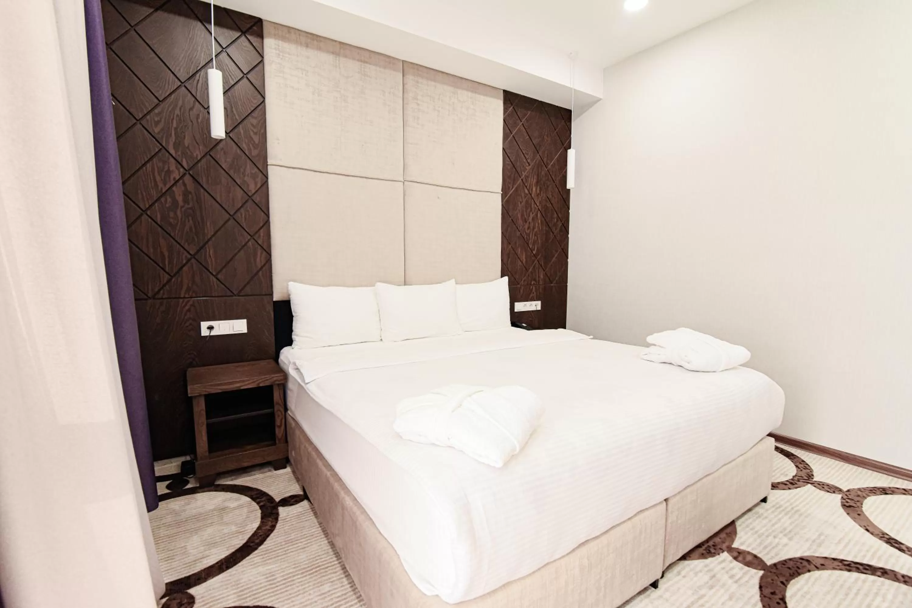 Bed in East Palace Hotel