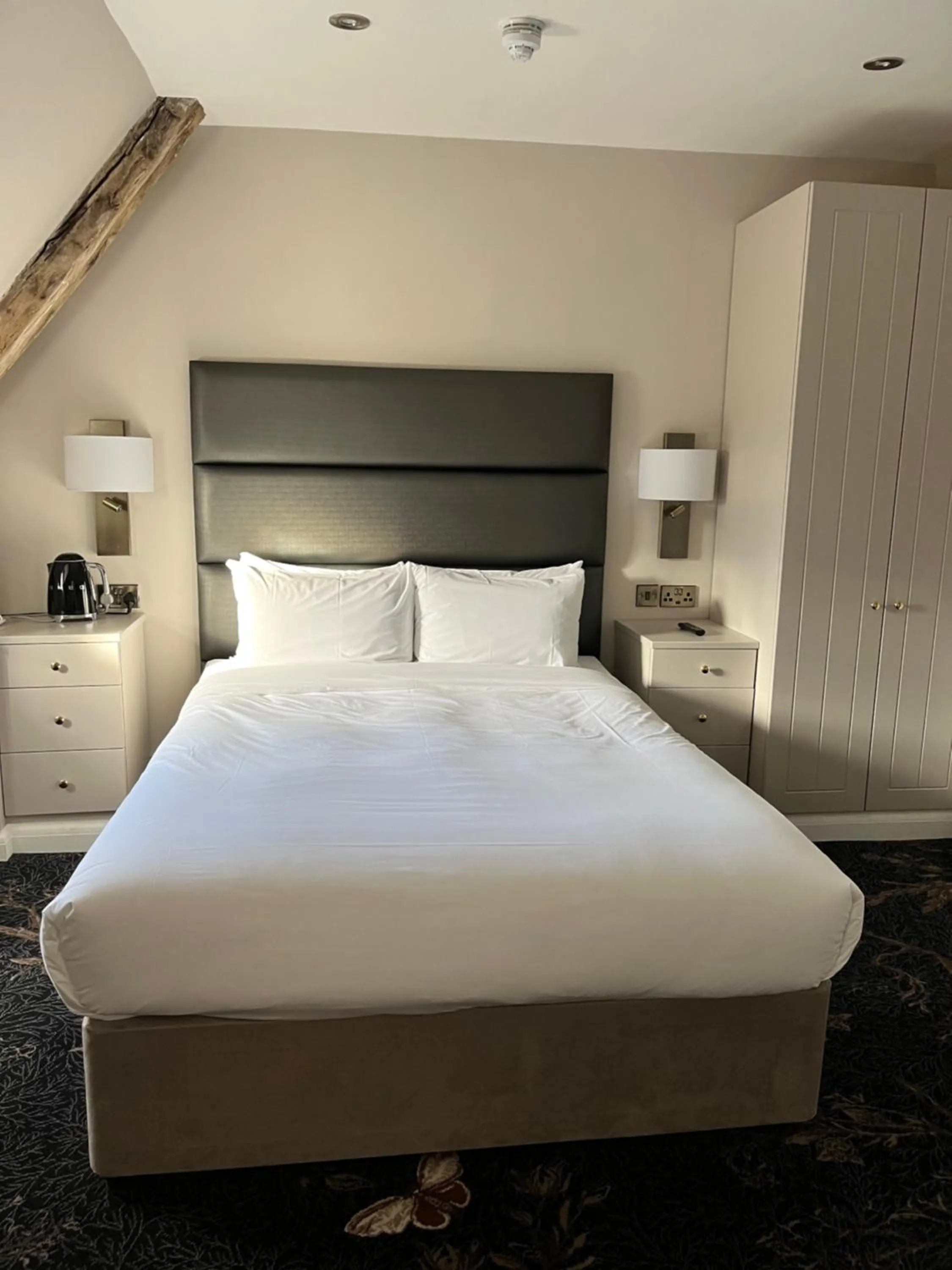 Bed in The Haycock Manor Hotel