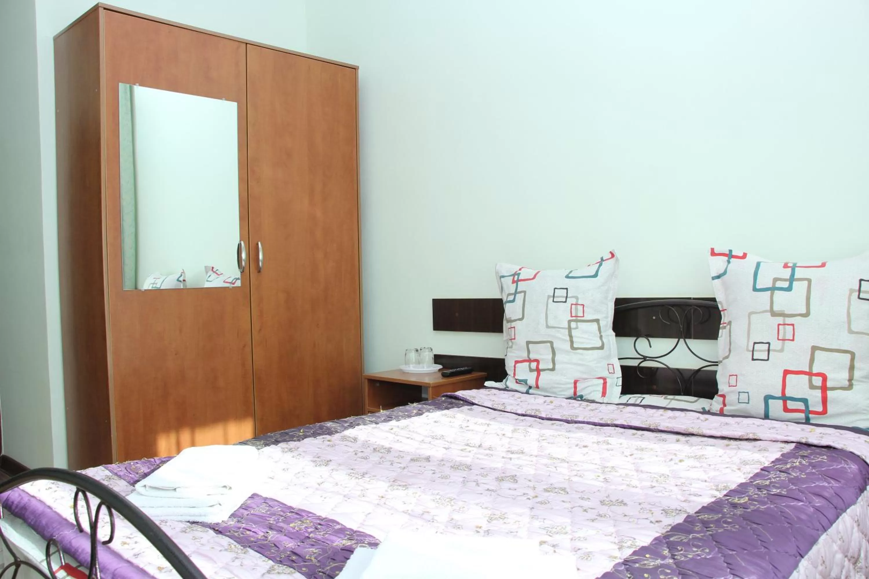 Bed in Zhaylau Hotel