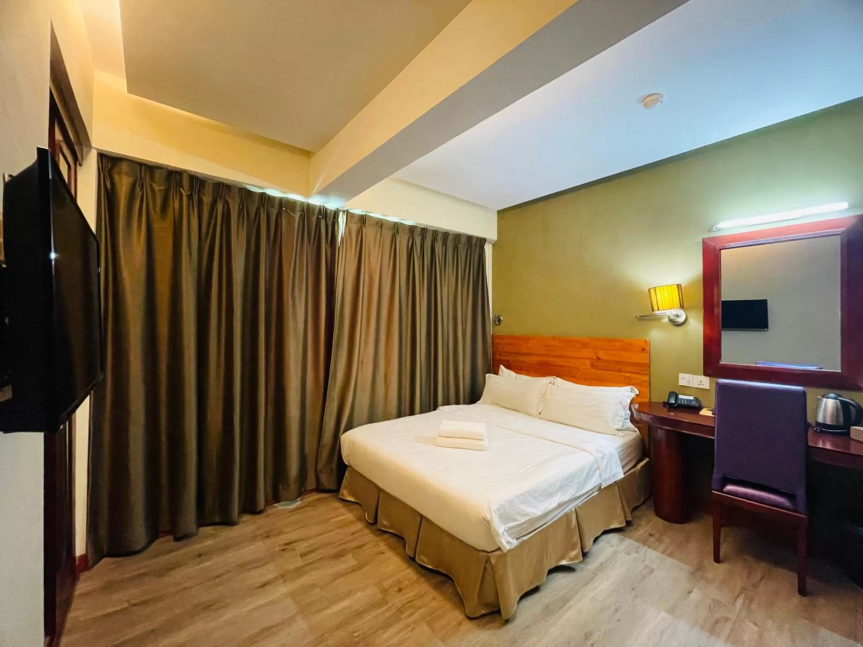 Bed in Celyn City Hotel