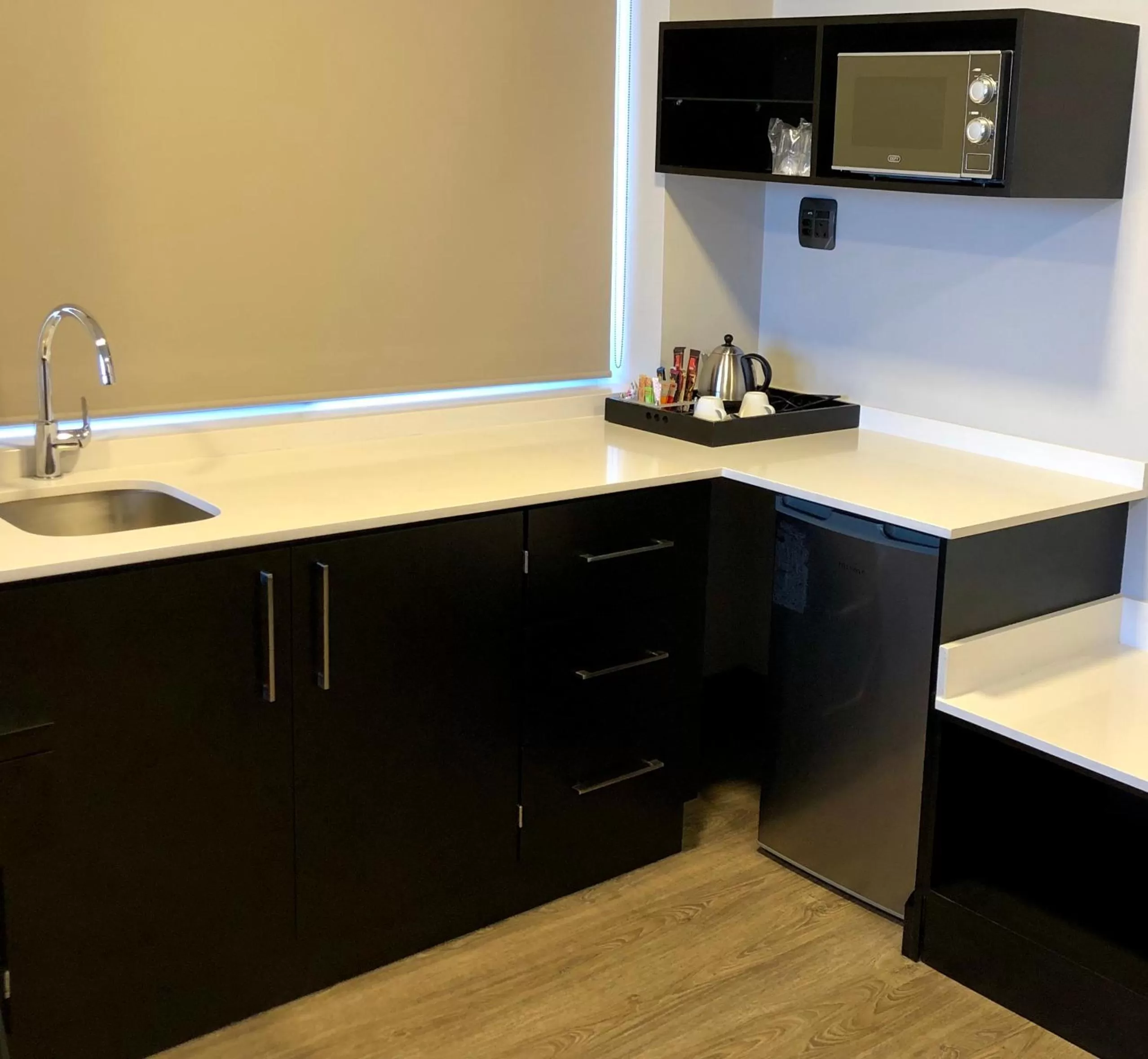 Kitchen or kitchenette in Belaire Suites Hotel