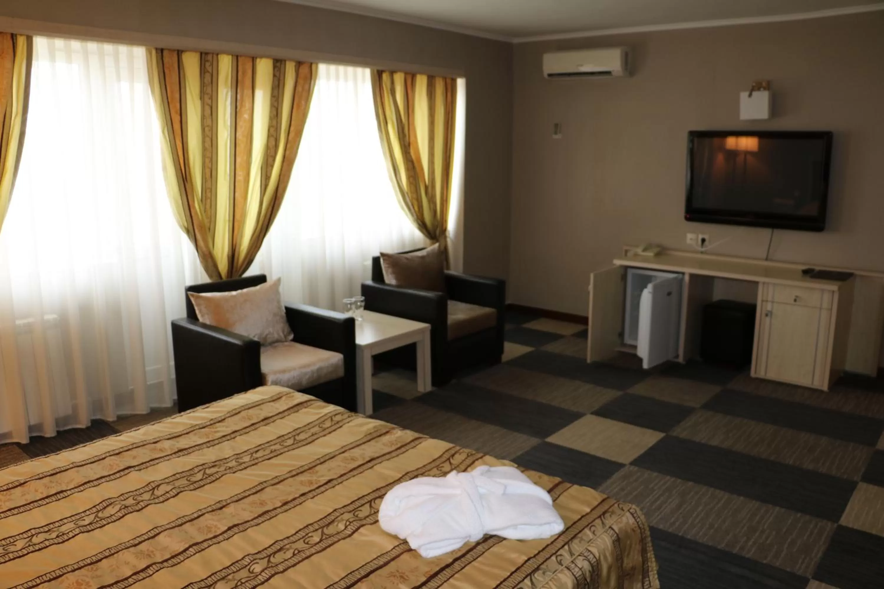 TV and multimedia, TV/Entertainment Center in Aktau Hotel