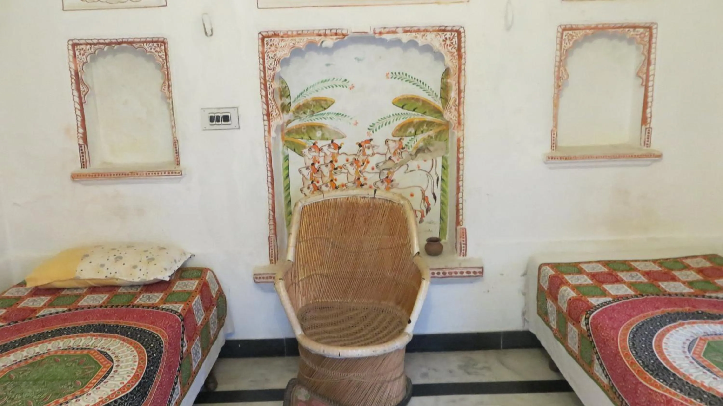 Seating area, Bed in Udai Haveli Guest House