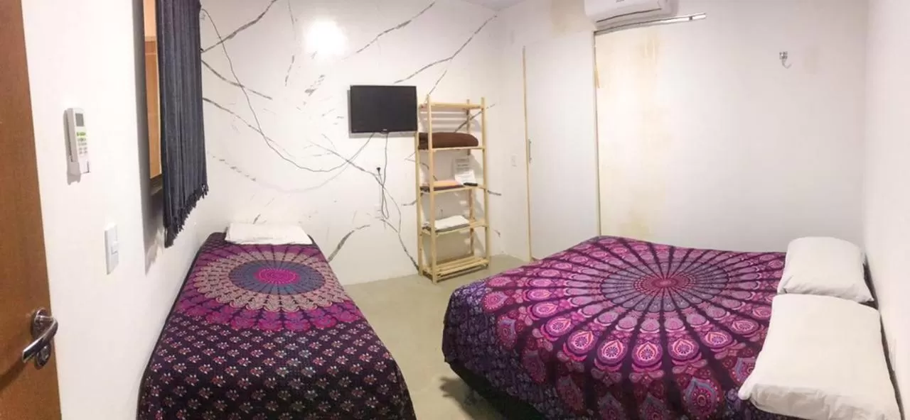 Bed in Pousada Casa de Vó