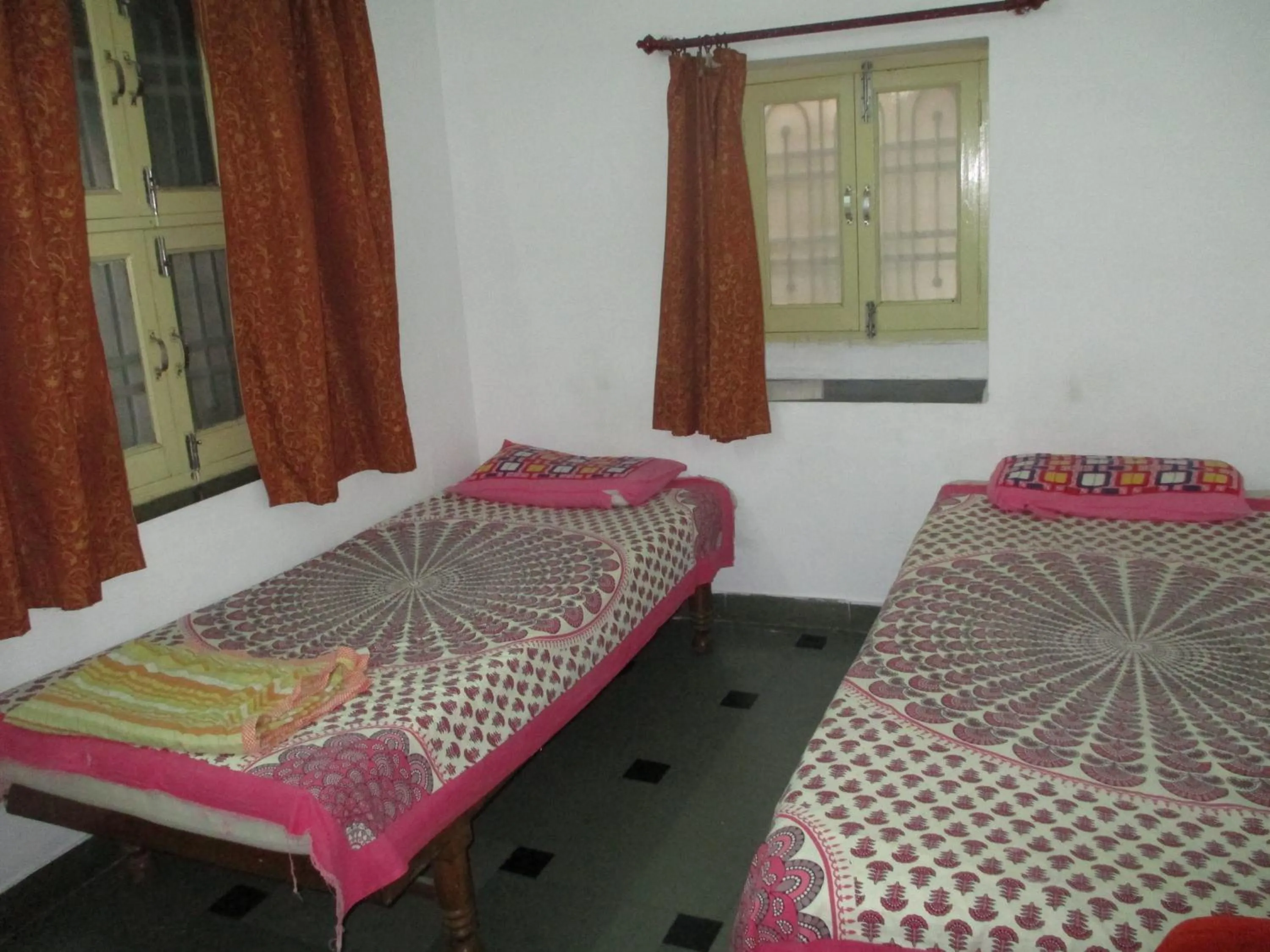 Bed in Udai Haveli Guest House