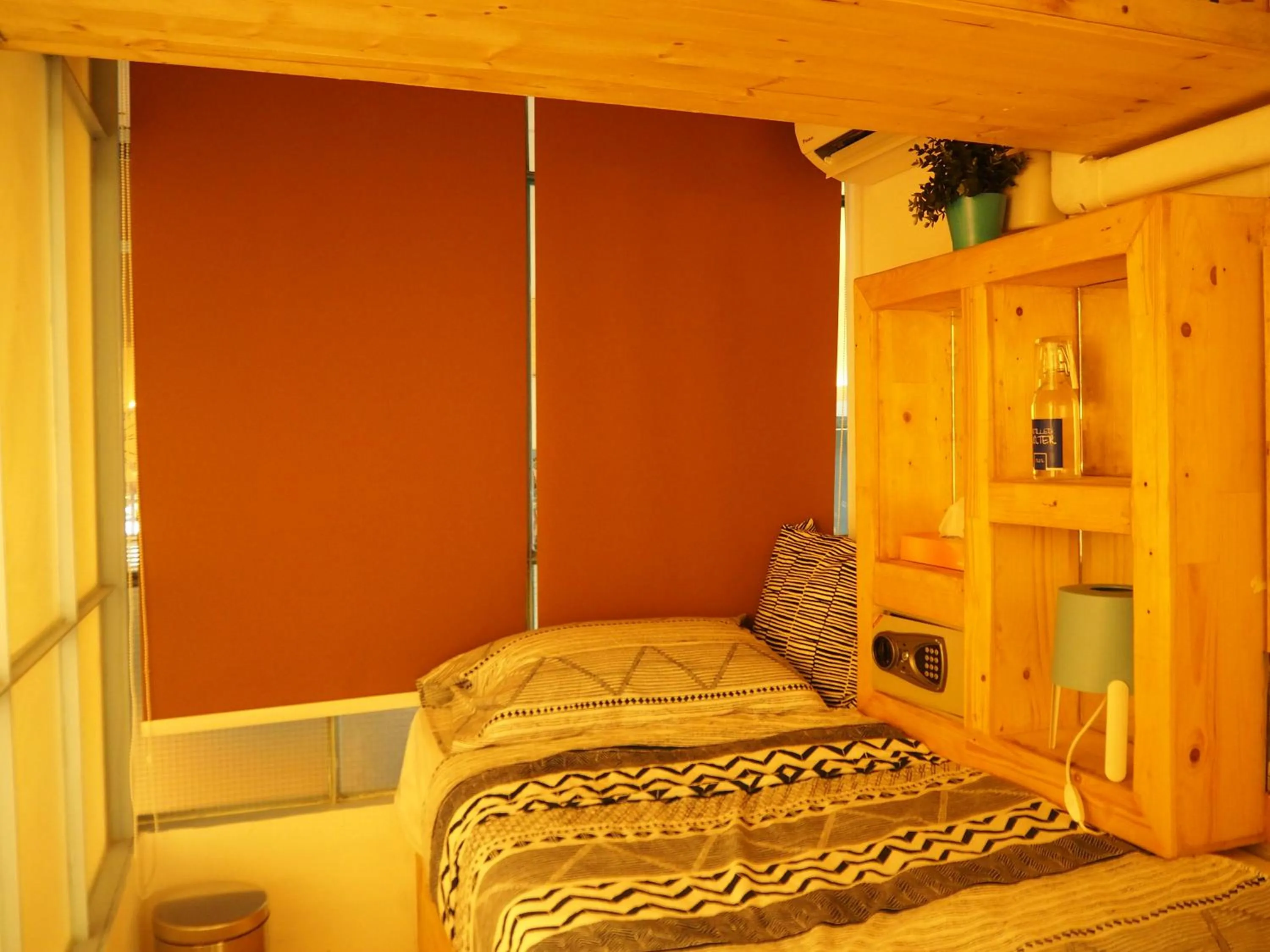 Seating area, Bed in Blu Cabin Ari Stylish Gay Poshtel