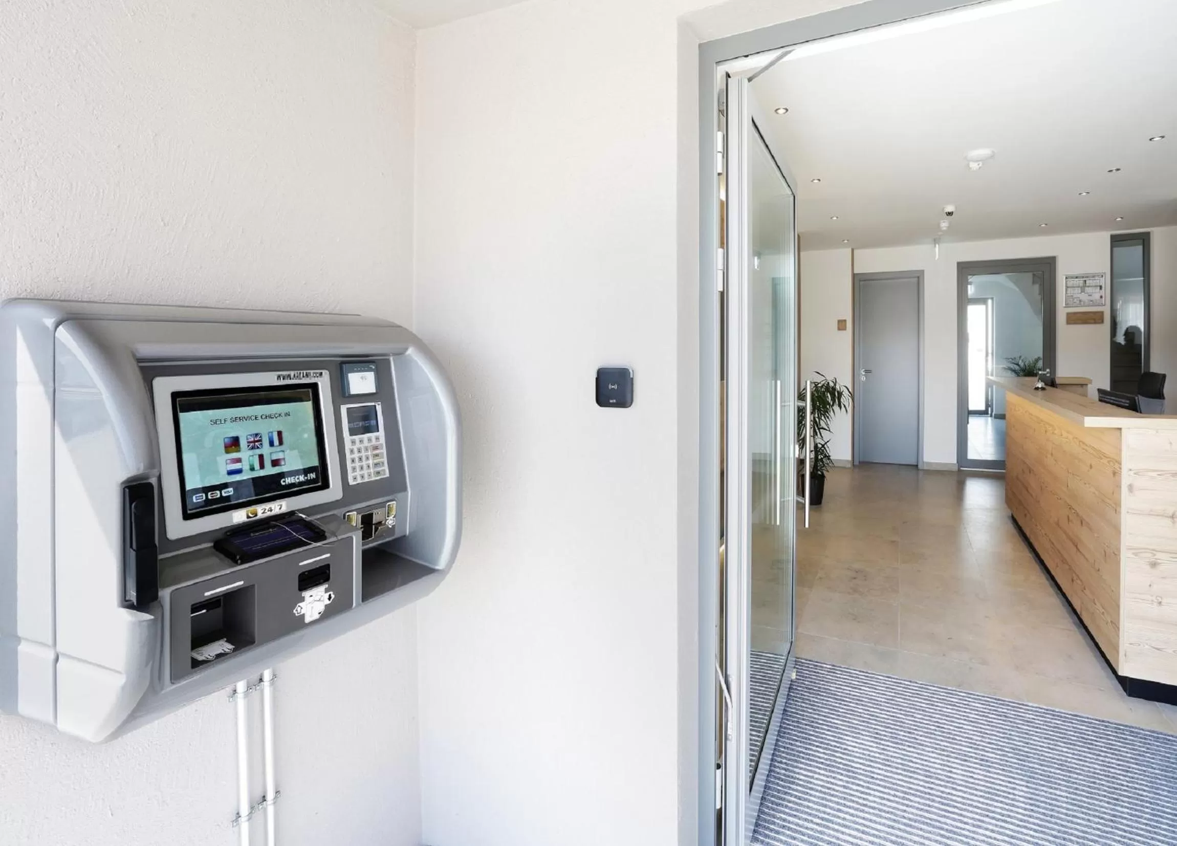 Facade/entrance, TV/Entertainment Center in easy sleep Apartmenthotel