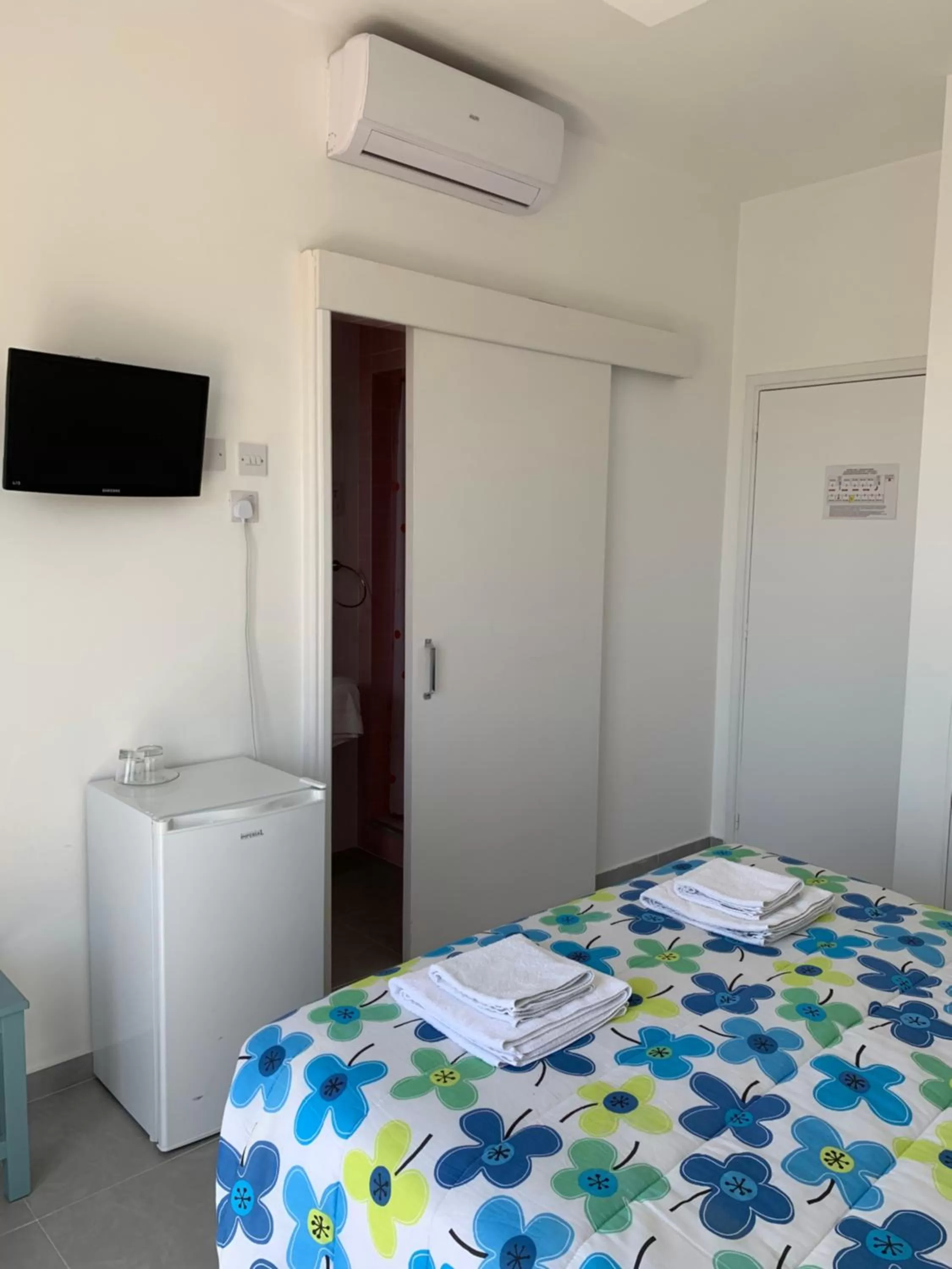 Bed in Axiothea Hotel