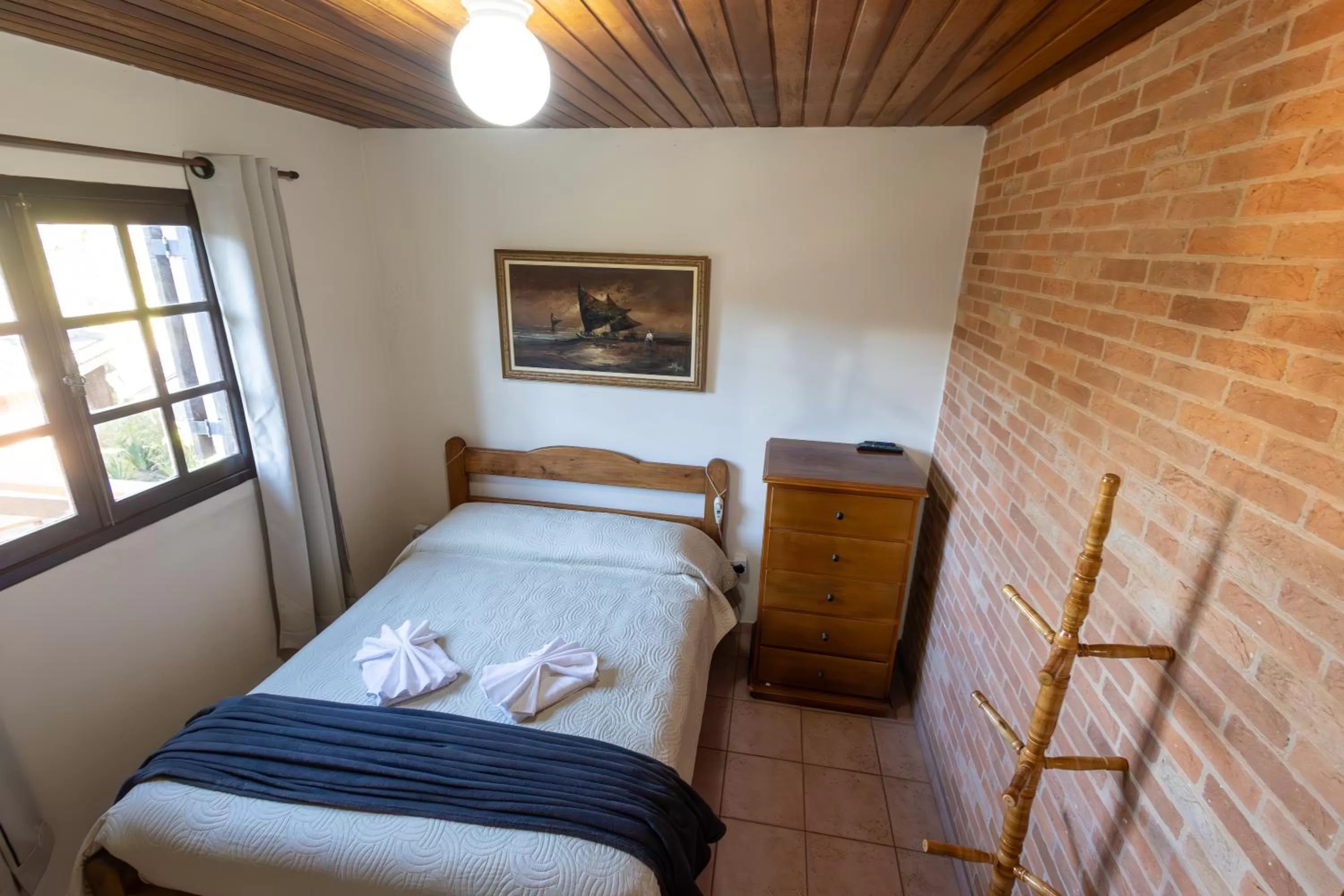 Bed in Chalés 3 Pinheiros