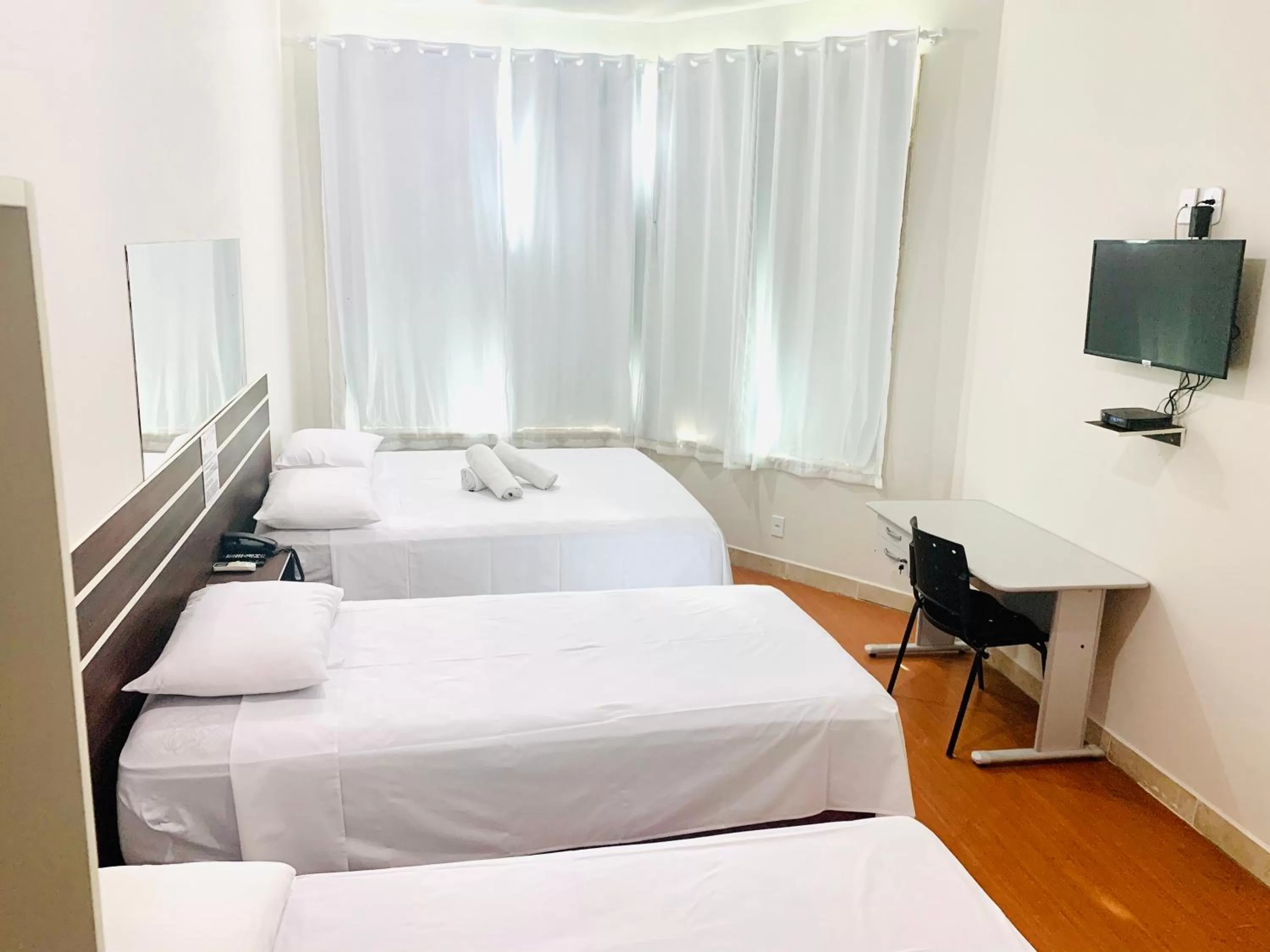 Bed in SAMIR HOTEL COMFORT