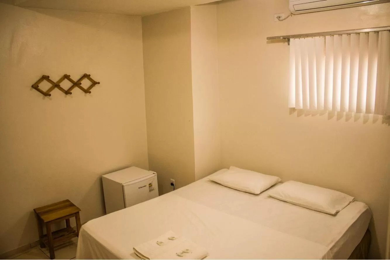 Bed in Pousada Vila do Carmo