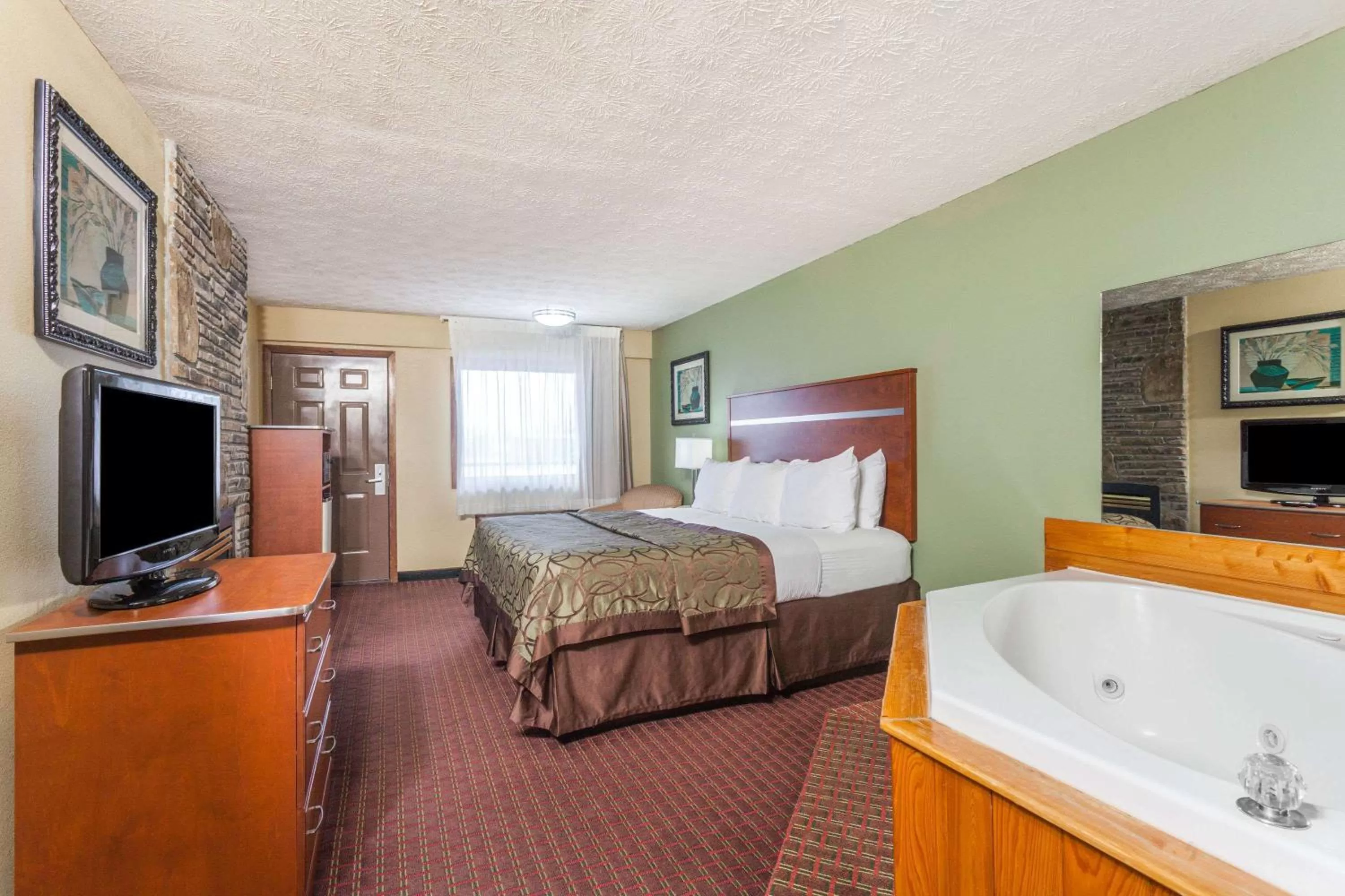 Photo of the whole room, Bed in Baymont by Wyndham Pigeon Forge near Island Drive