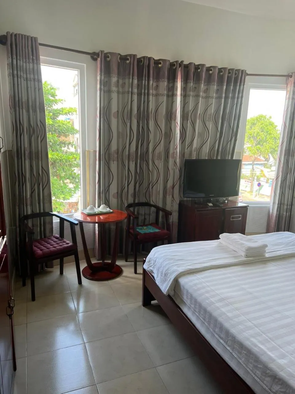 Seating area, Bed in Kim Long Hotel