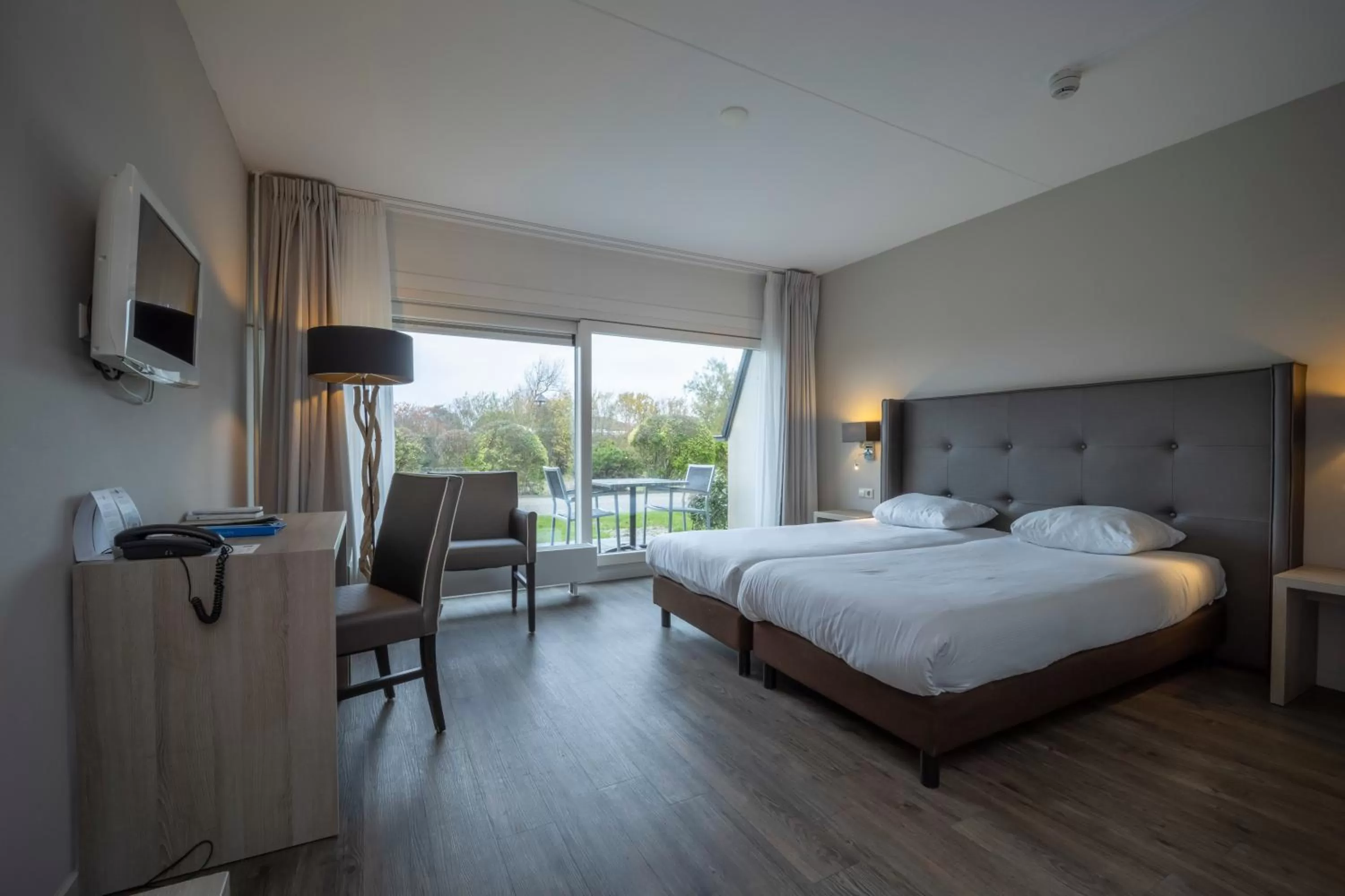 Photo of the whole room, Bed in Fletcher Zuiderduin Beachhotel