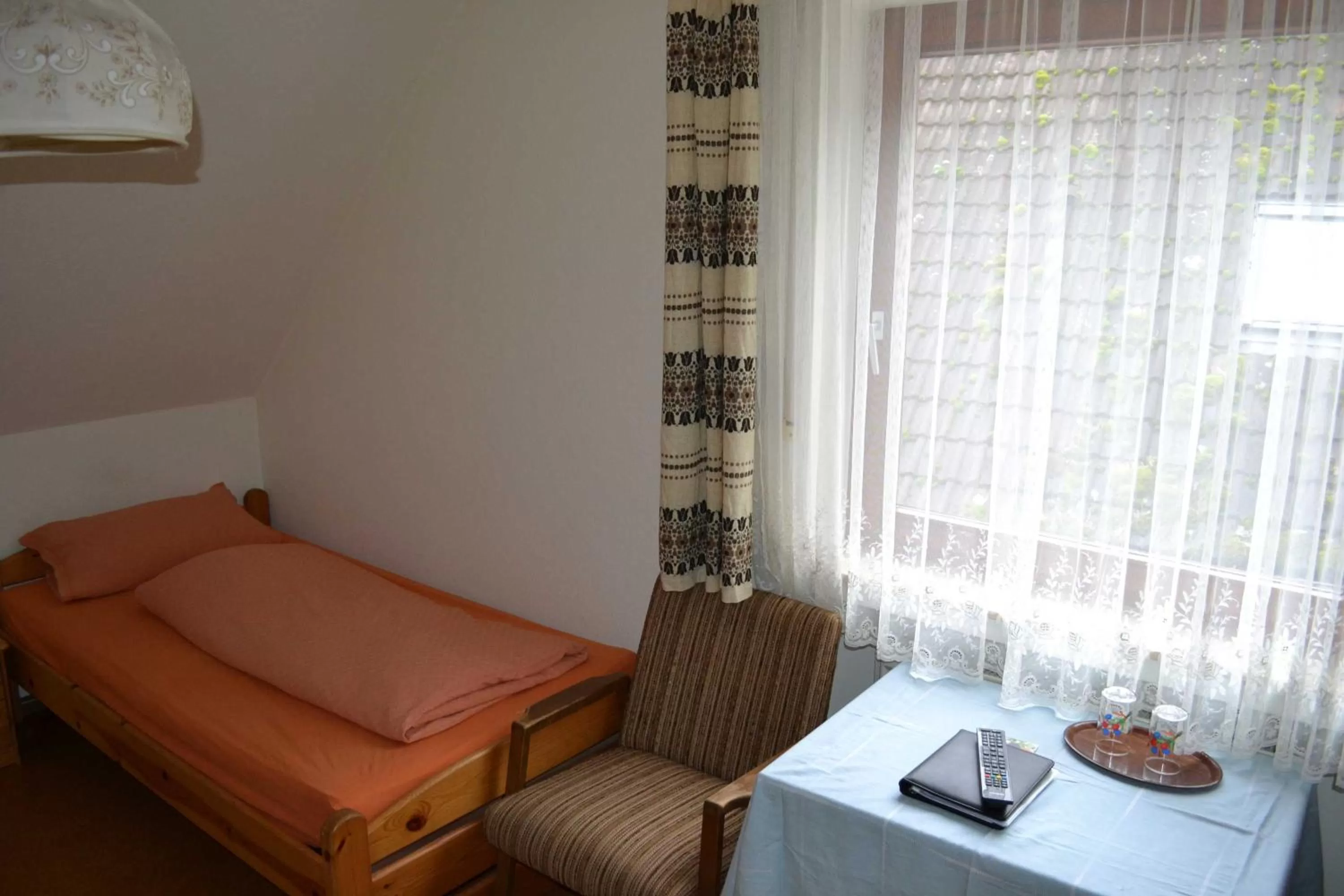 Photo of the whole room, Bed in Gaestehaus Tagescafe Eckenfels