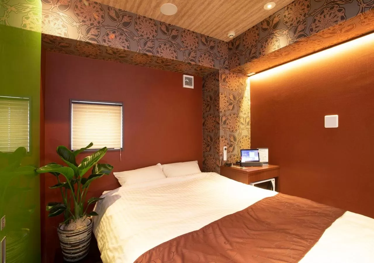 Bed in Pinpon Hotel Hiroshima