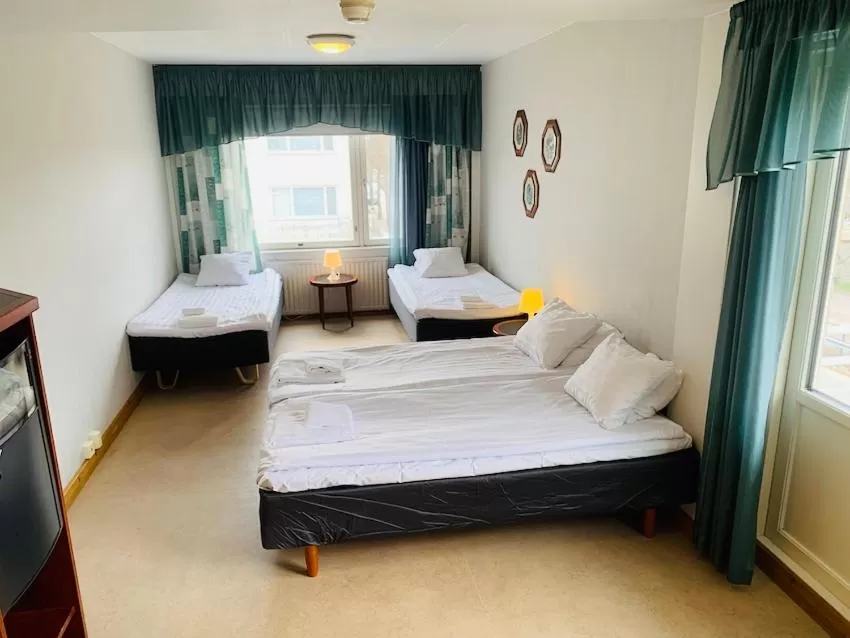 Bedroom, Bed in Hotelli Uninen Kotka