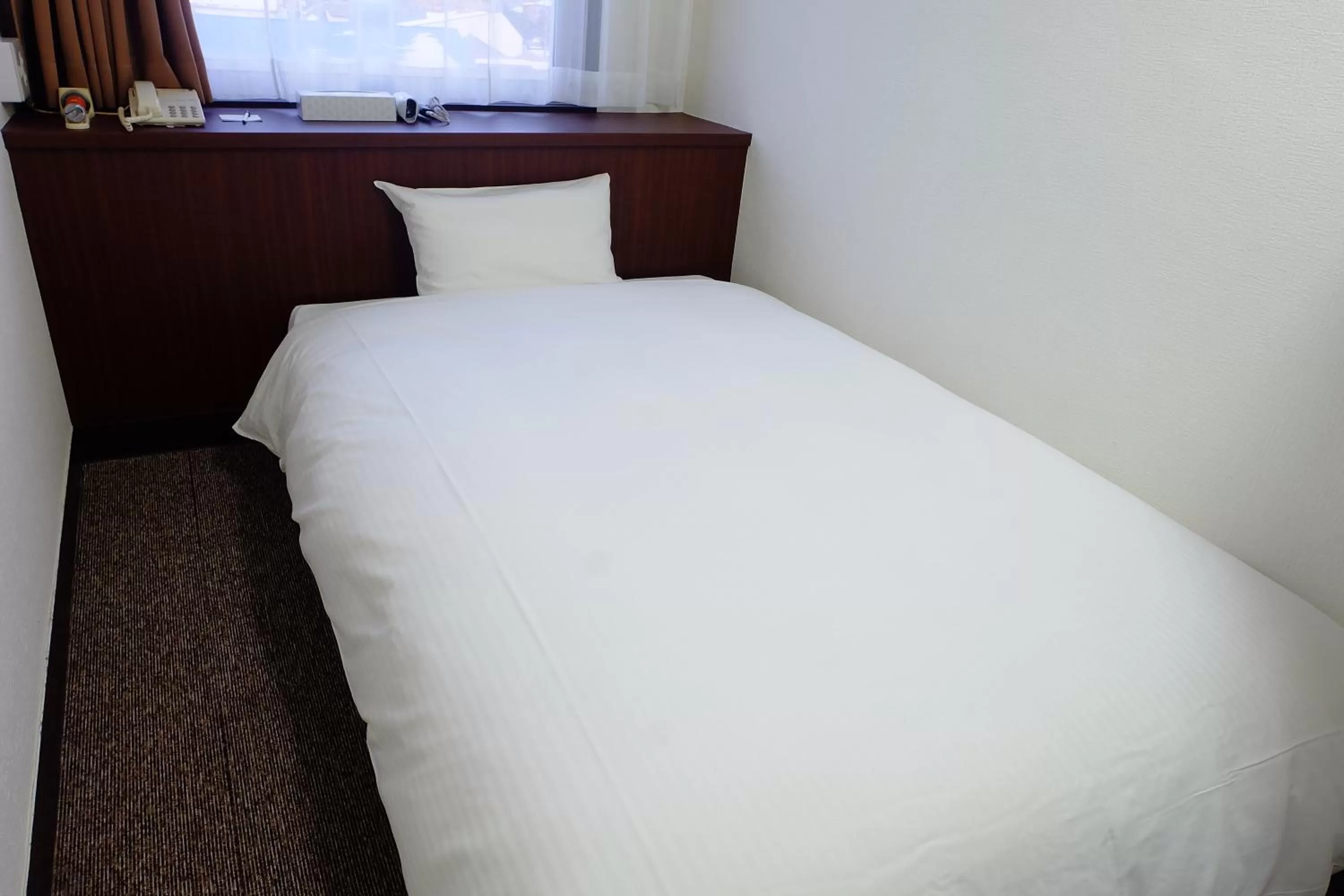 Bed in Tabist Hotel Tetora Hakodate Station