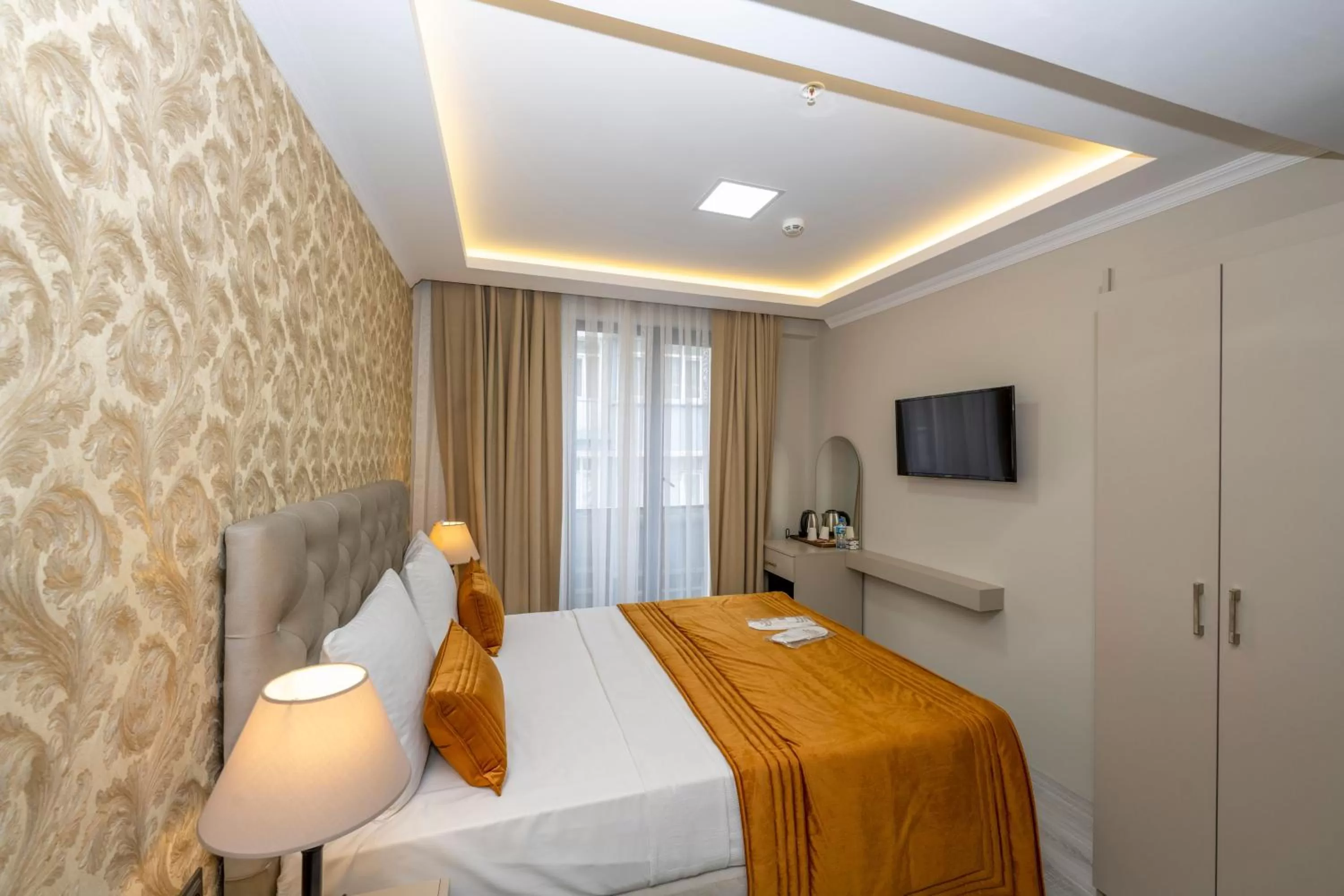 Bed in SKYSTAR DELUXE HOTEL