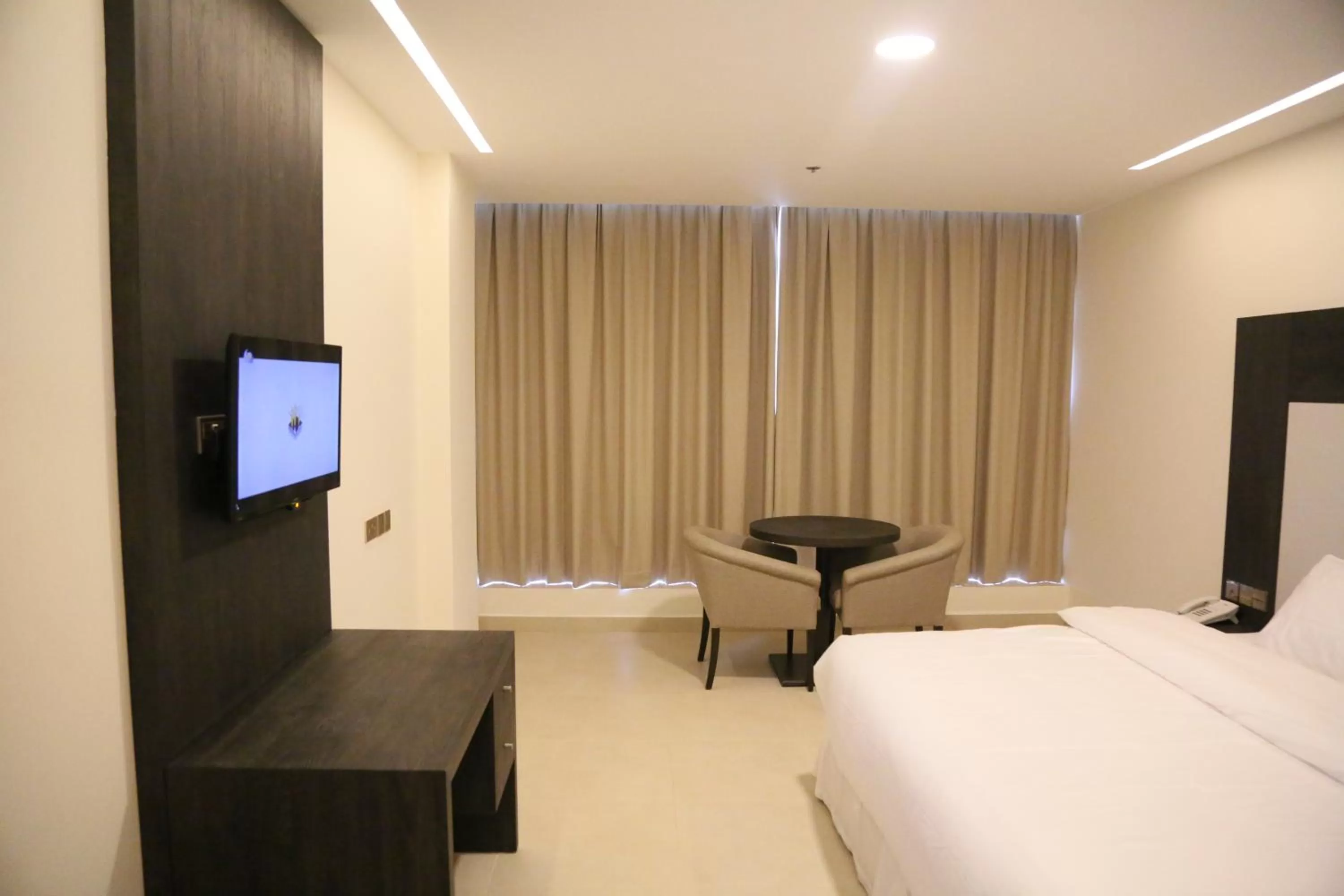 Bed in Manazil Aldar Hotel