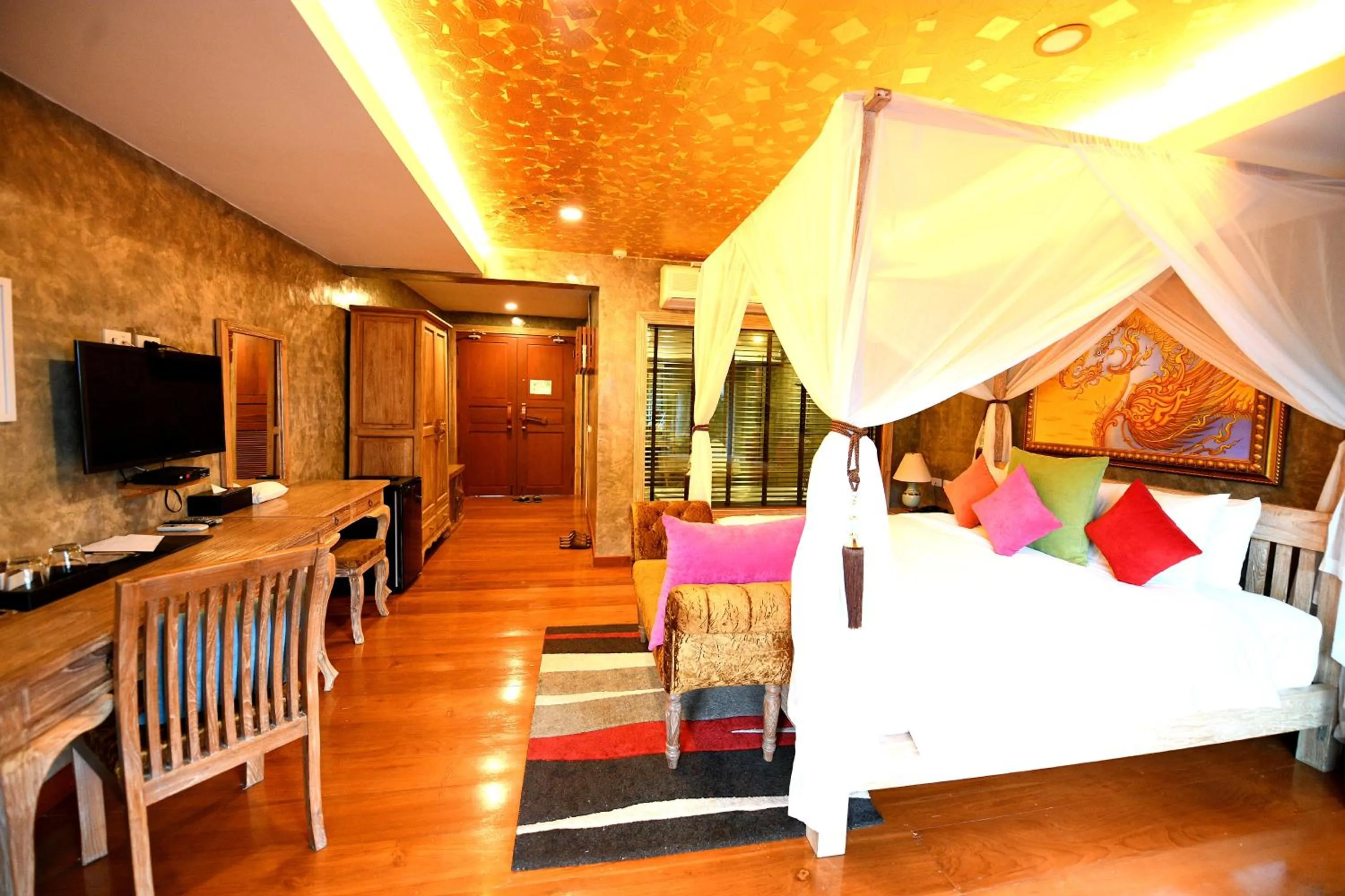 Bed in The Chaya Resort and Spa