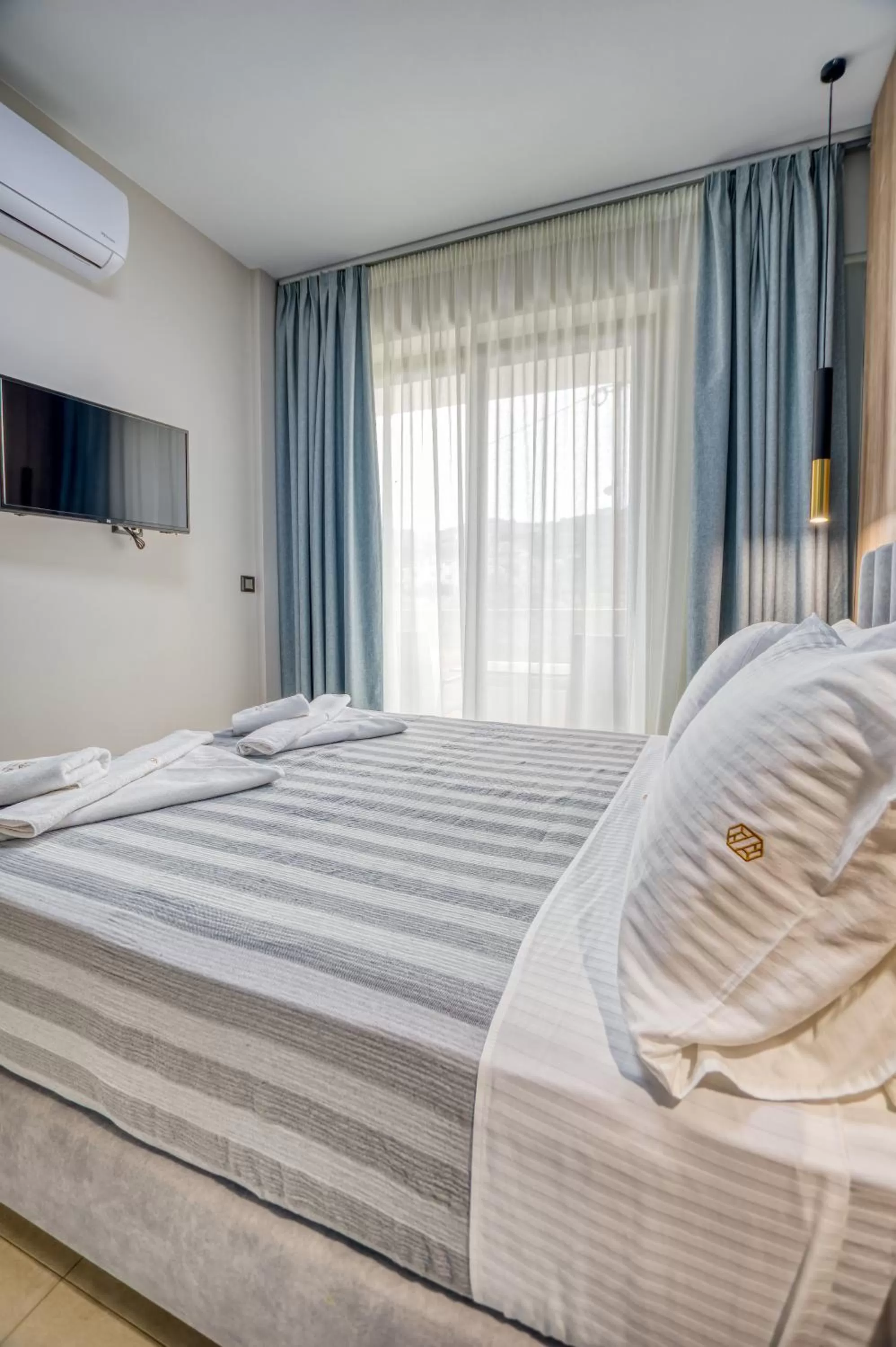 Bed in Sapphire Horizon Suites