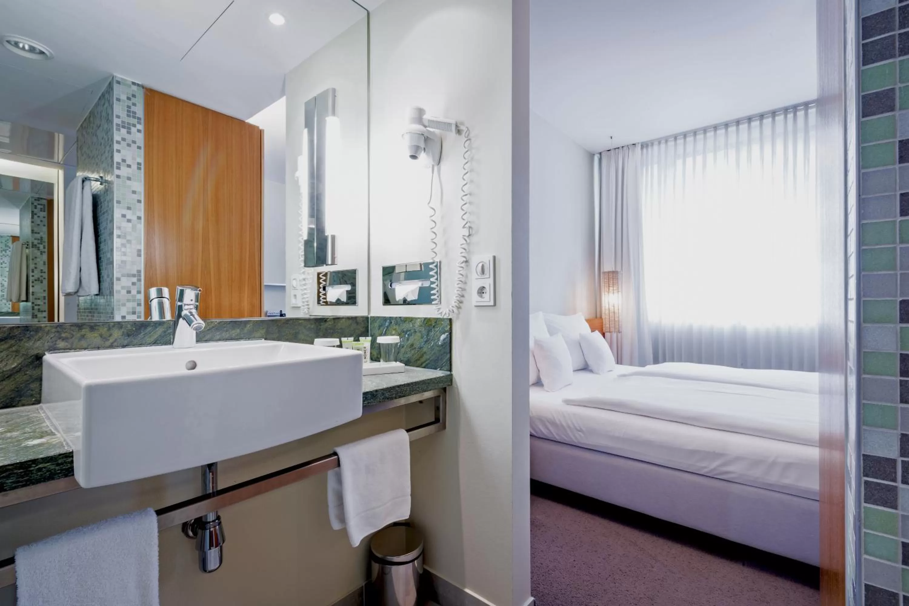 Bed in Lindner Hotel Berlin Ku'damm, part of JdV by Hyatt