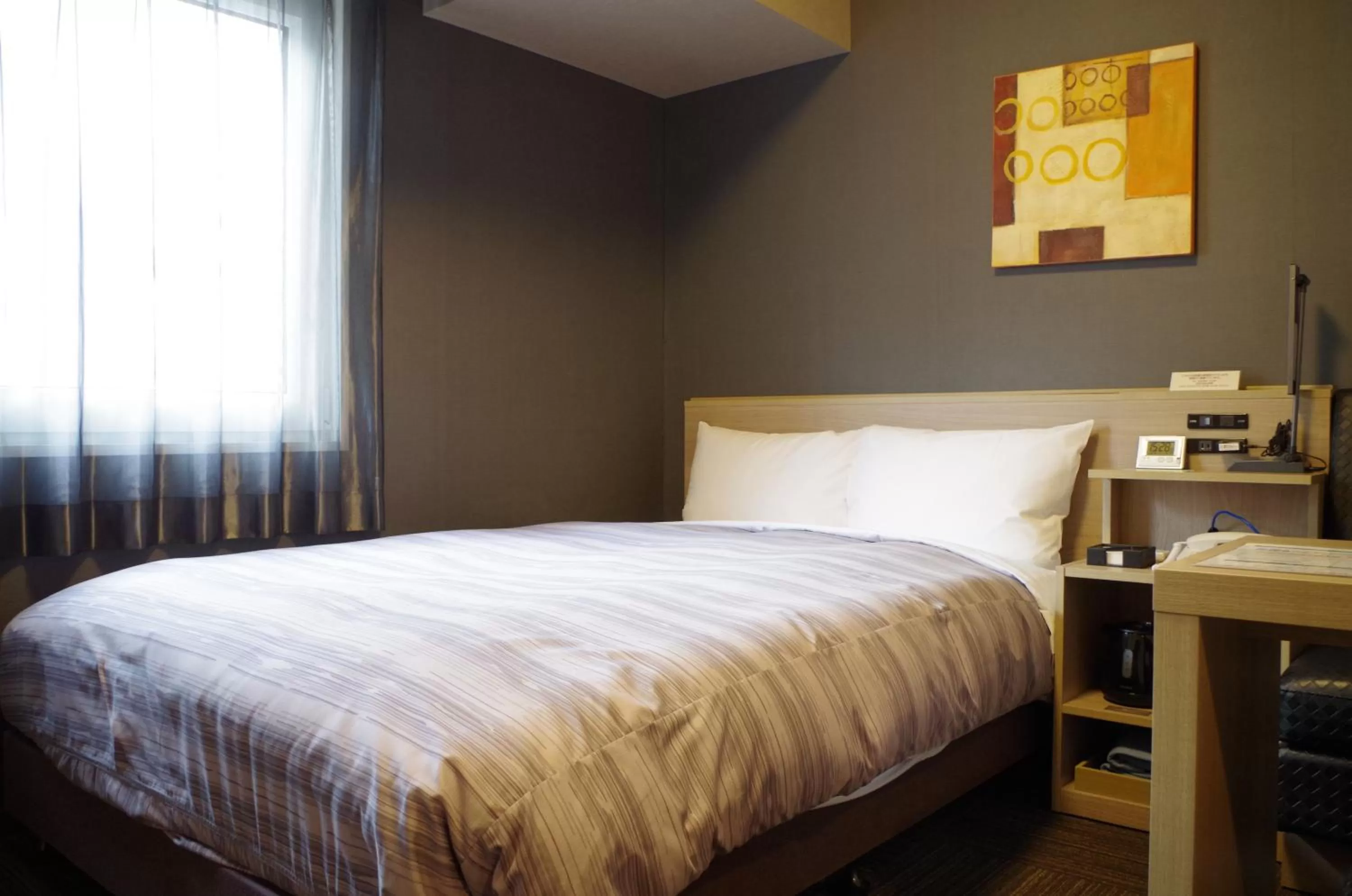 Photo of the whole room, Bed in Hotel Route-Inn Saiki Ekimae