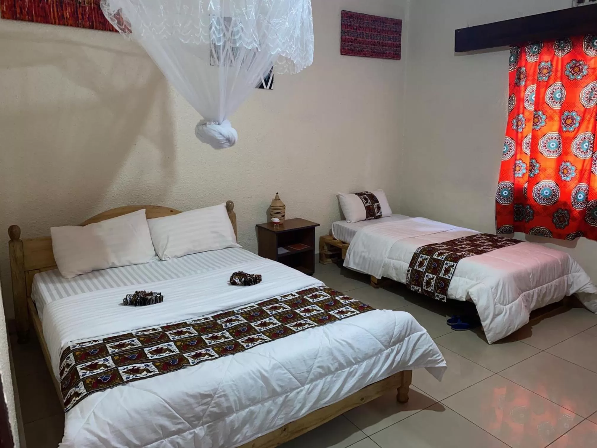 Bed in INZOZI AFRICA HOUSE B&B- Kacyiru