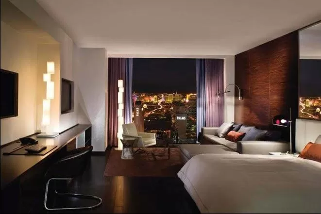 Bed in Palms Place Studio with Balcony & Strip View