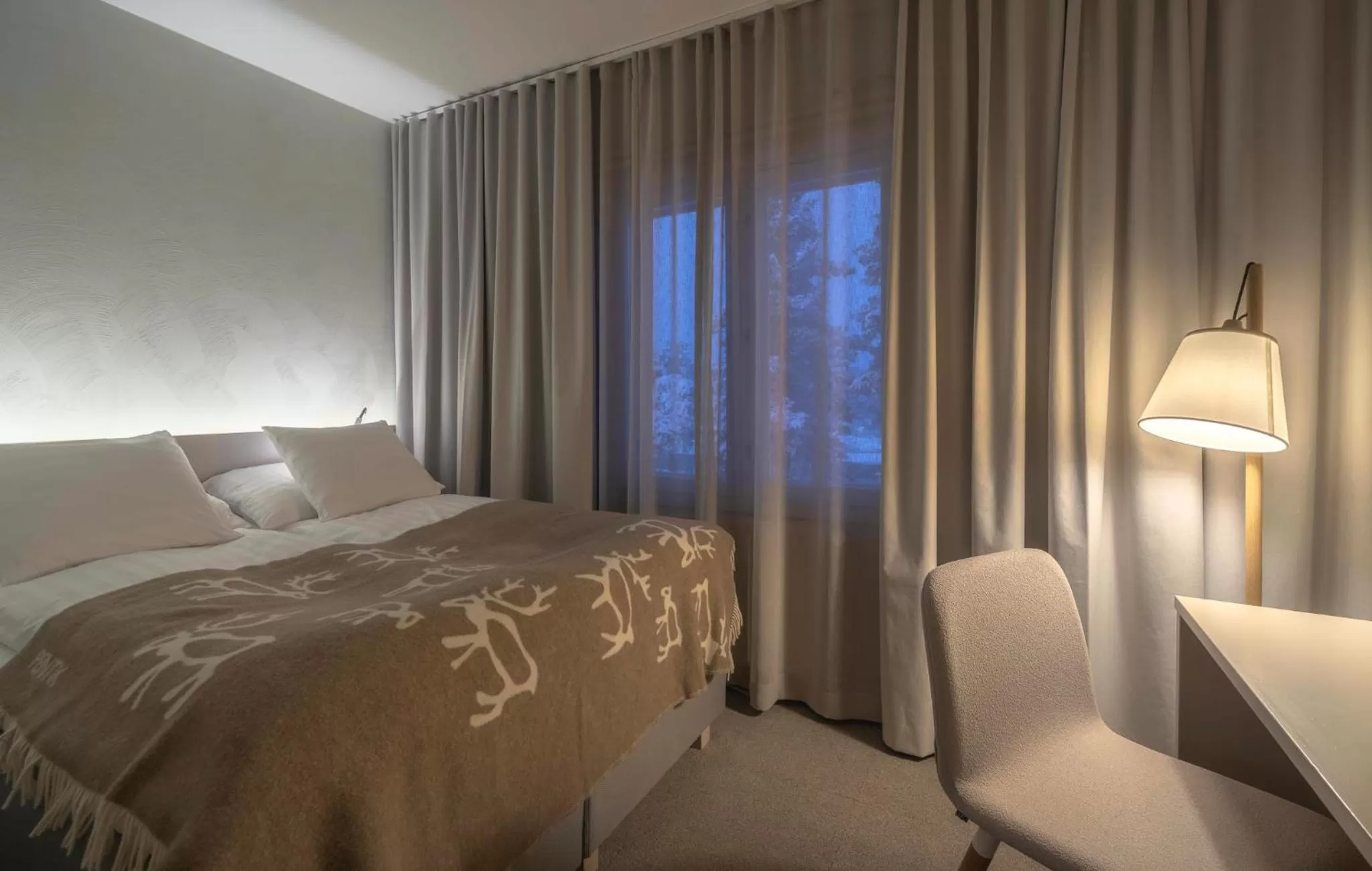 Bed in Wilderness Hotel Juutua