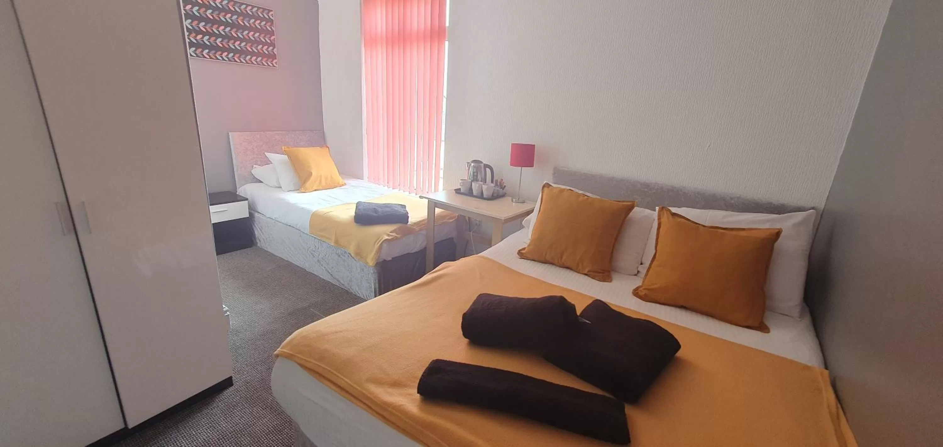 Bed in Palm Beach Hotel by the Sea