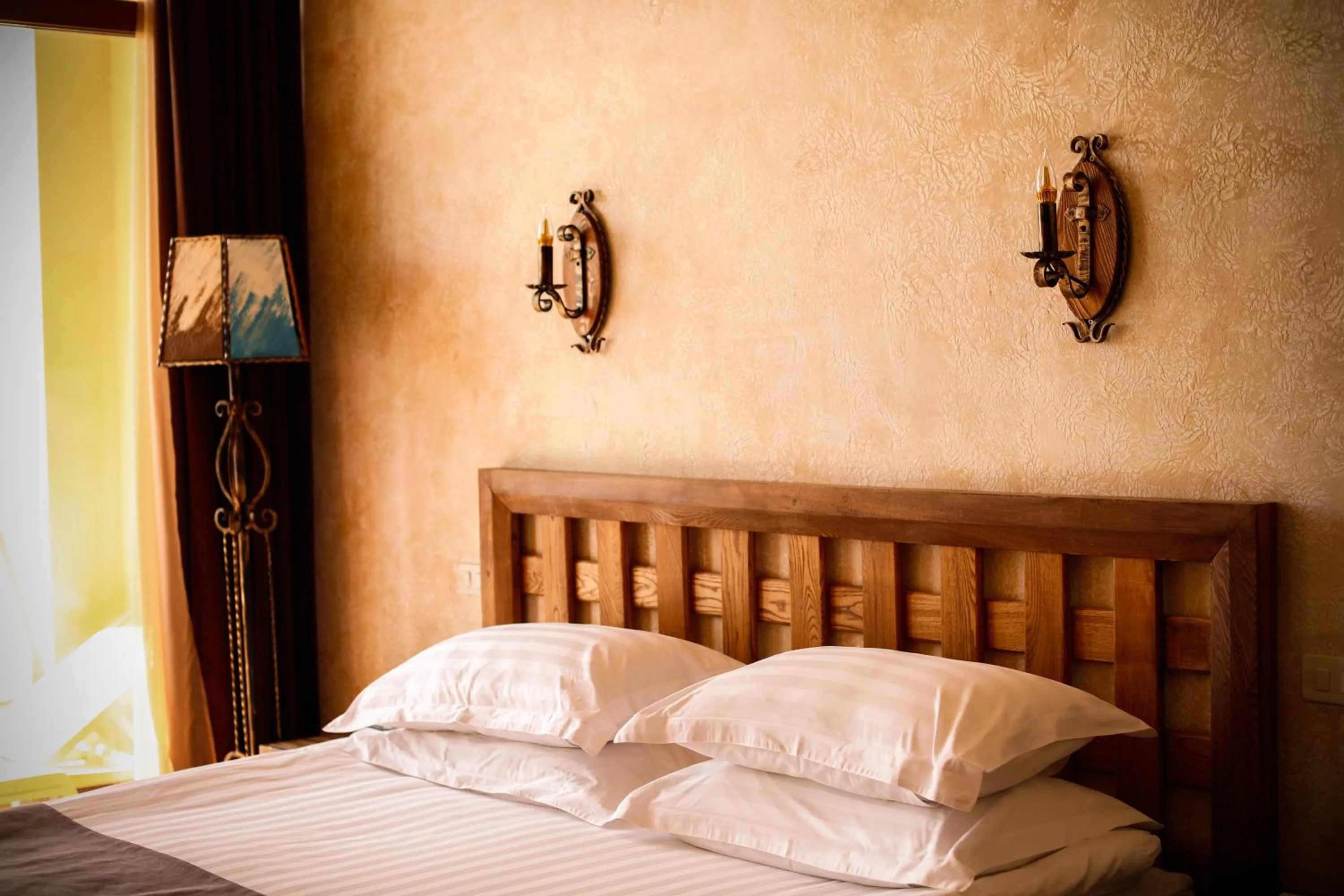 Bed in Caucasus Hotel