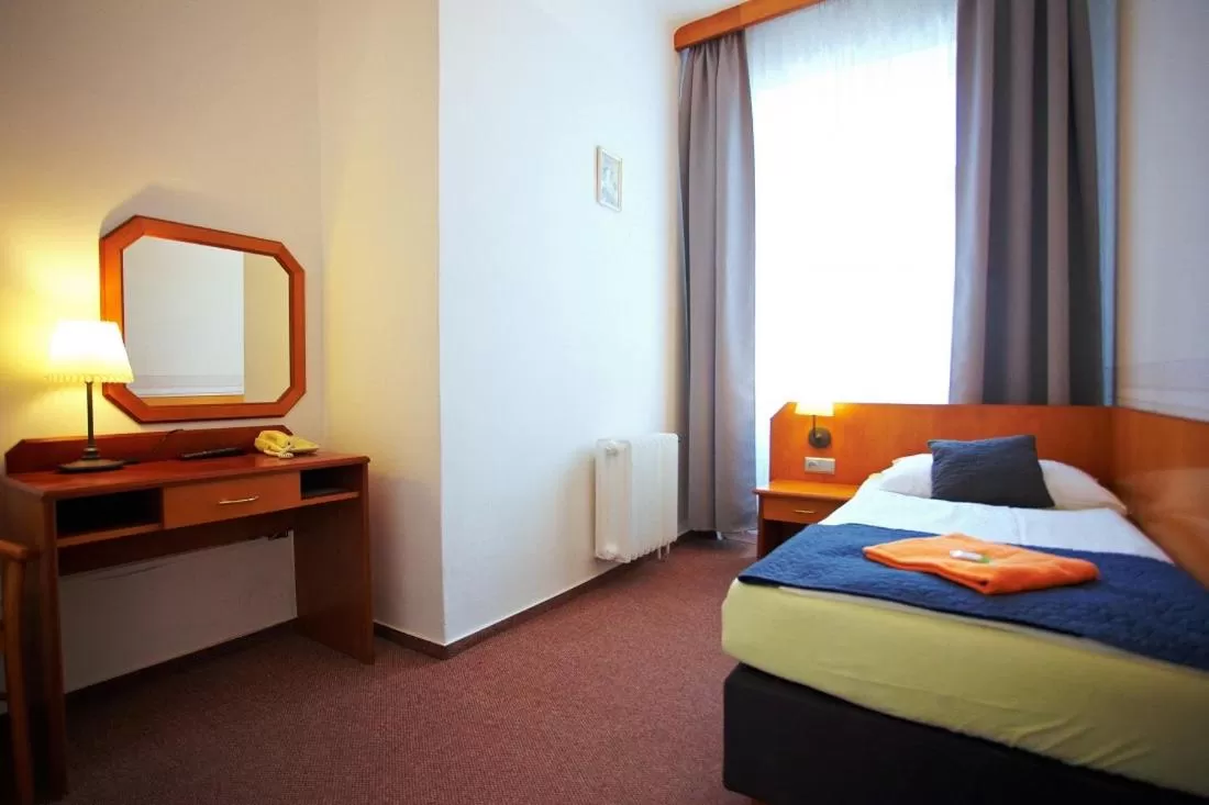 Bedroom, Bed in Wellness Hotel Central