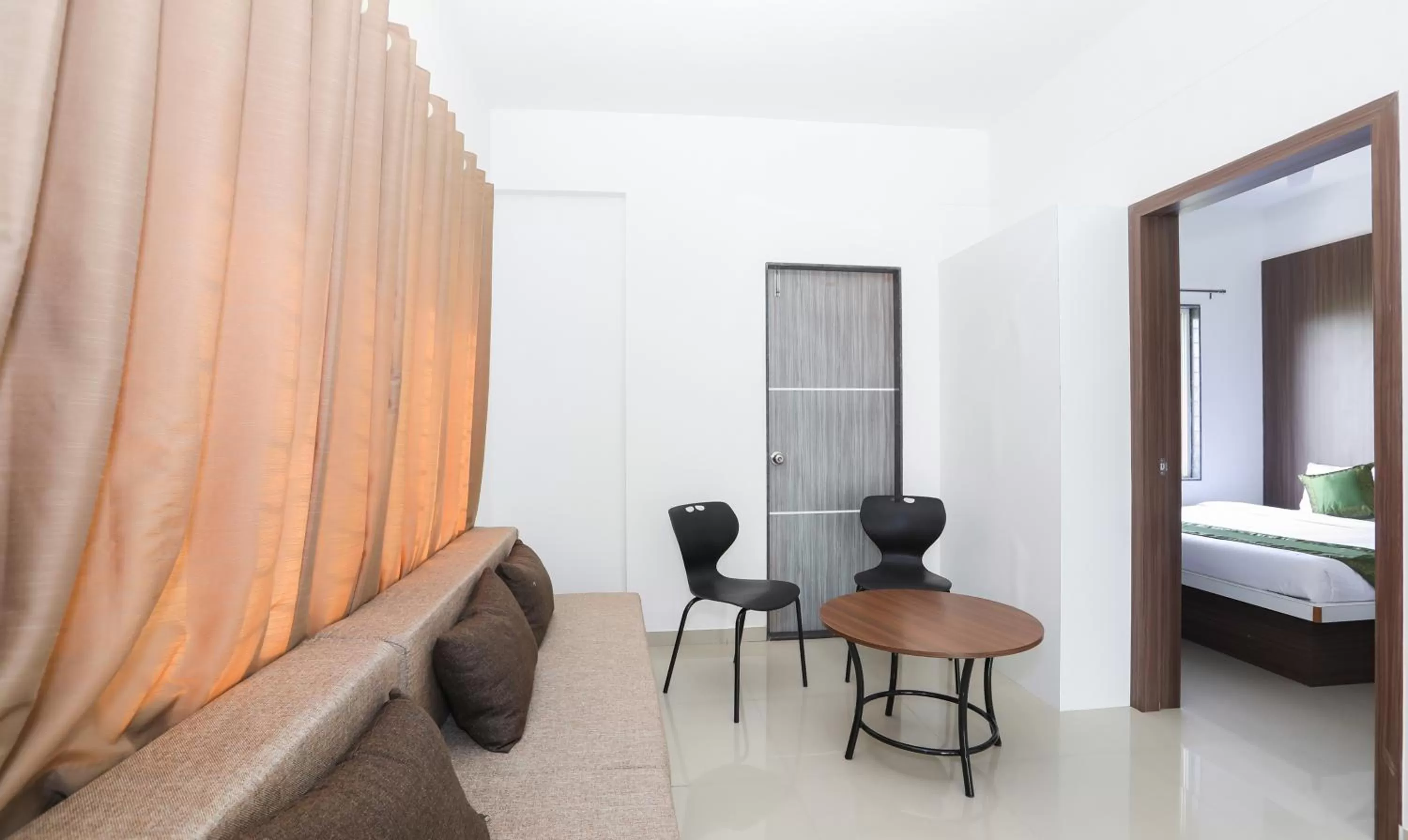 Seating area, Bed in Treebo Sapphire Studio